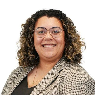 Woman in a suite smiling for the camera