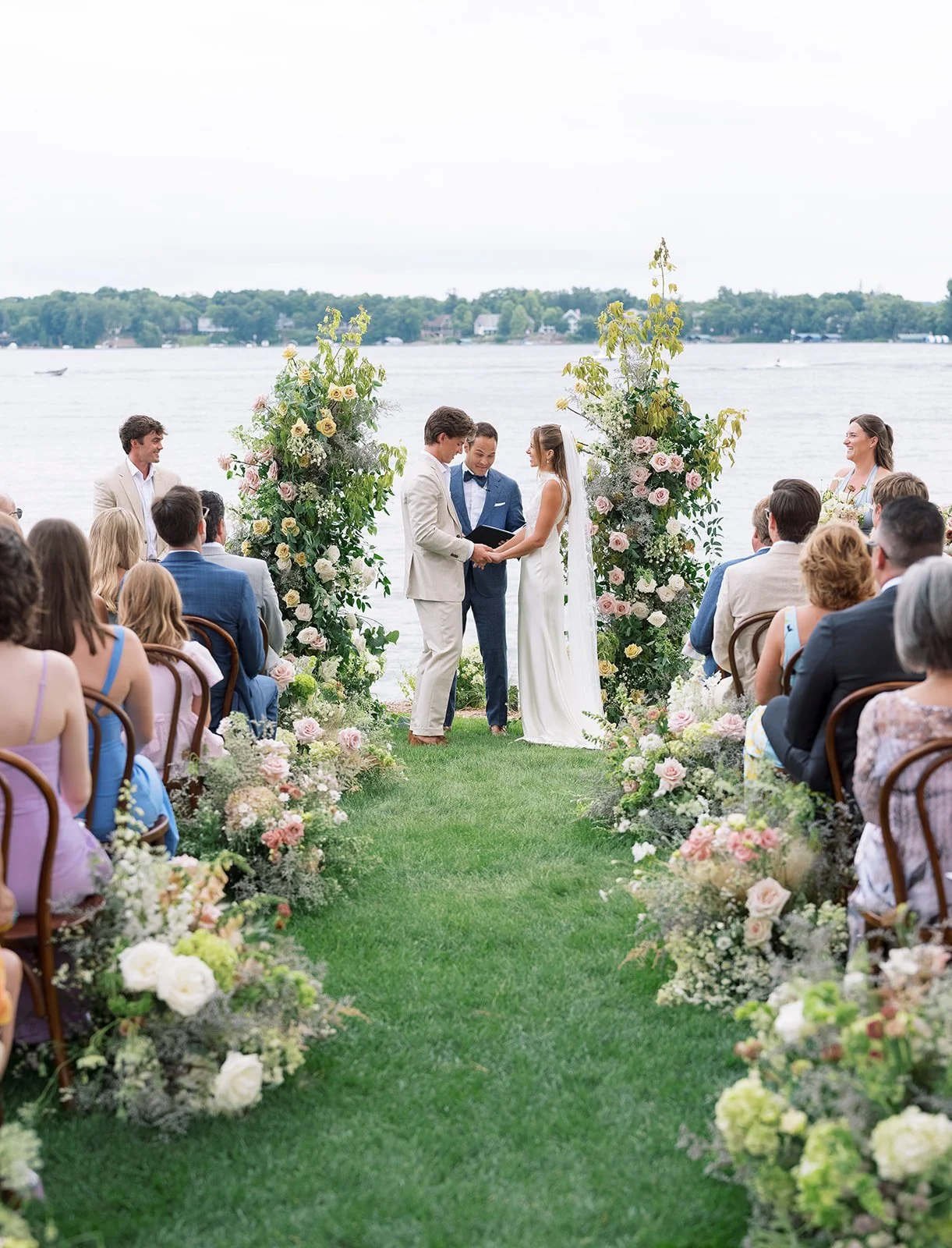 green and pink ceremony arch and aisle meadow - amanda nippoldt photography