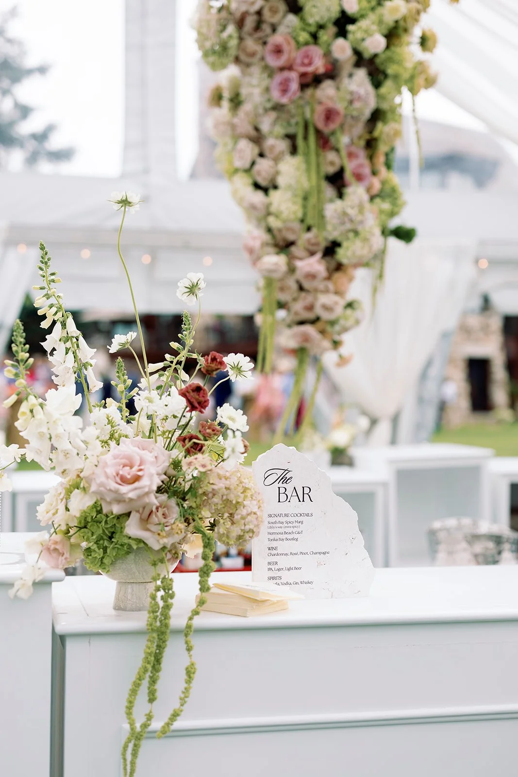 hanging flower installation in clear tent with apres and phos - amanda nippoldt photography