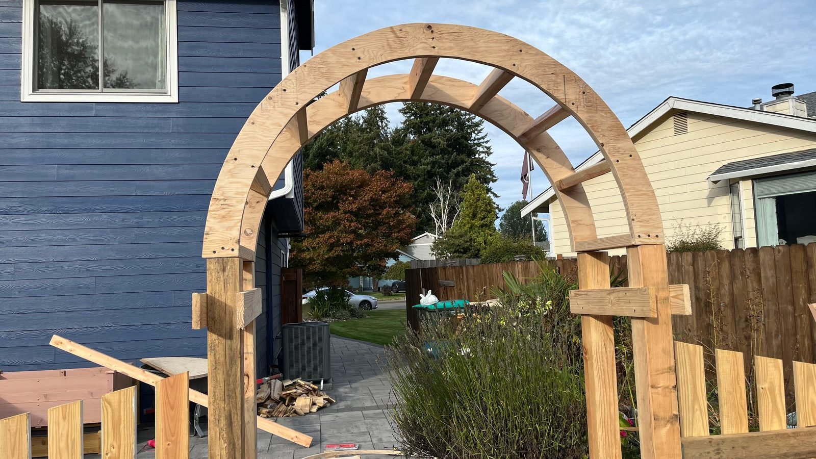New cedar arbor and picket gate beside a house in Lacey, WA