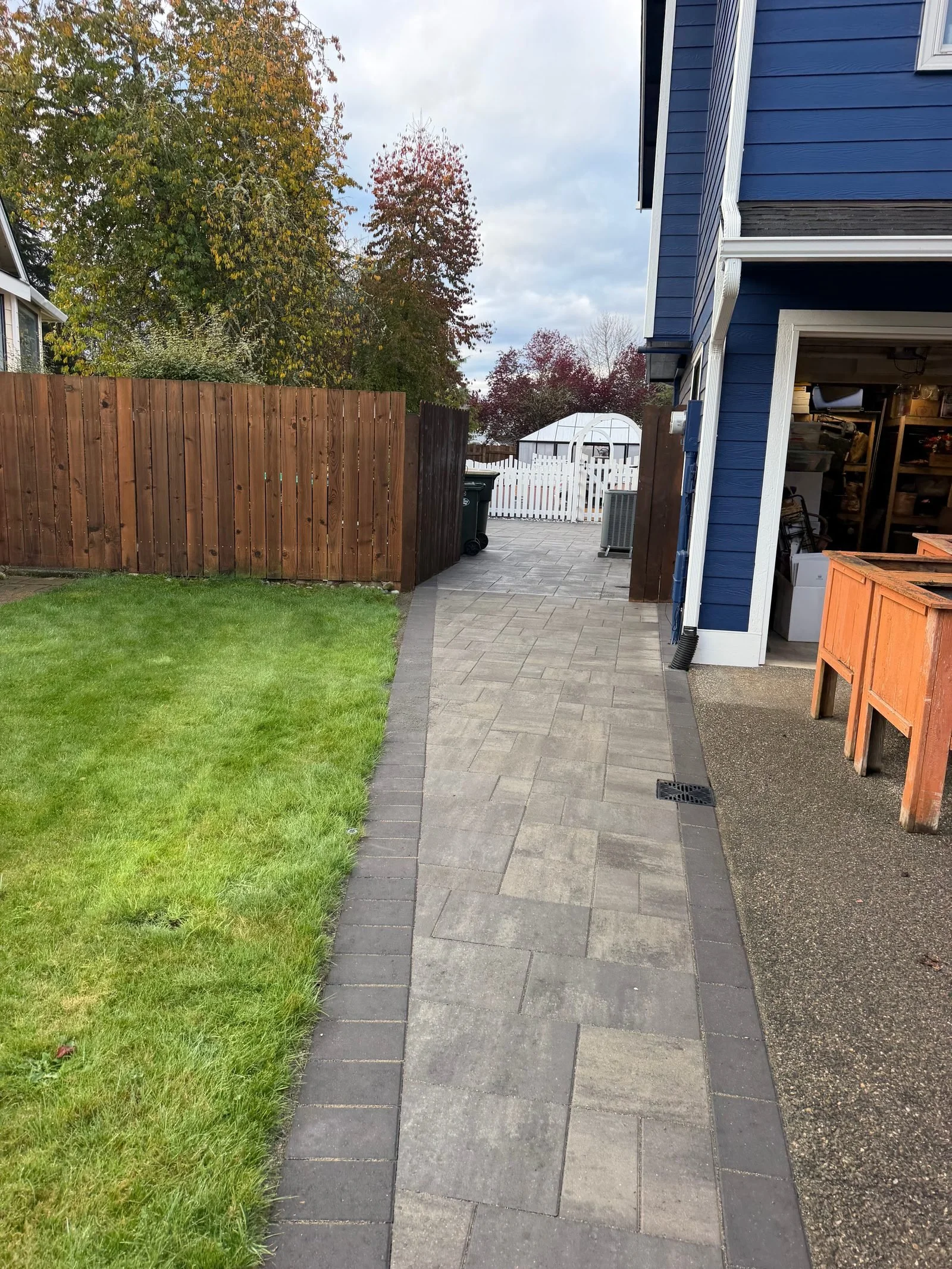 New paver walkway beside a blue house in Lacey, WA