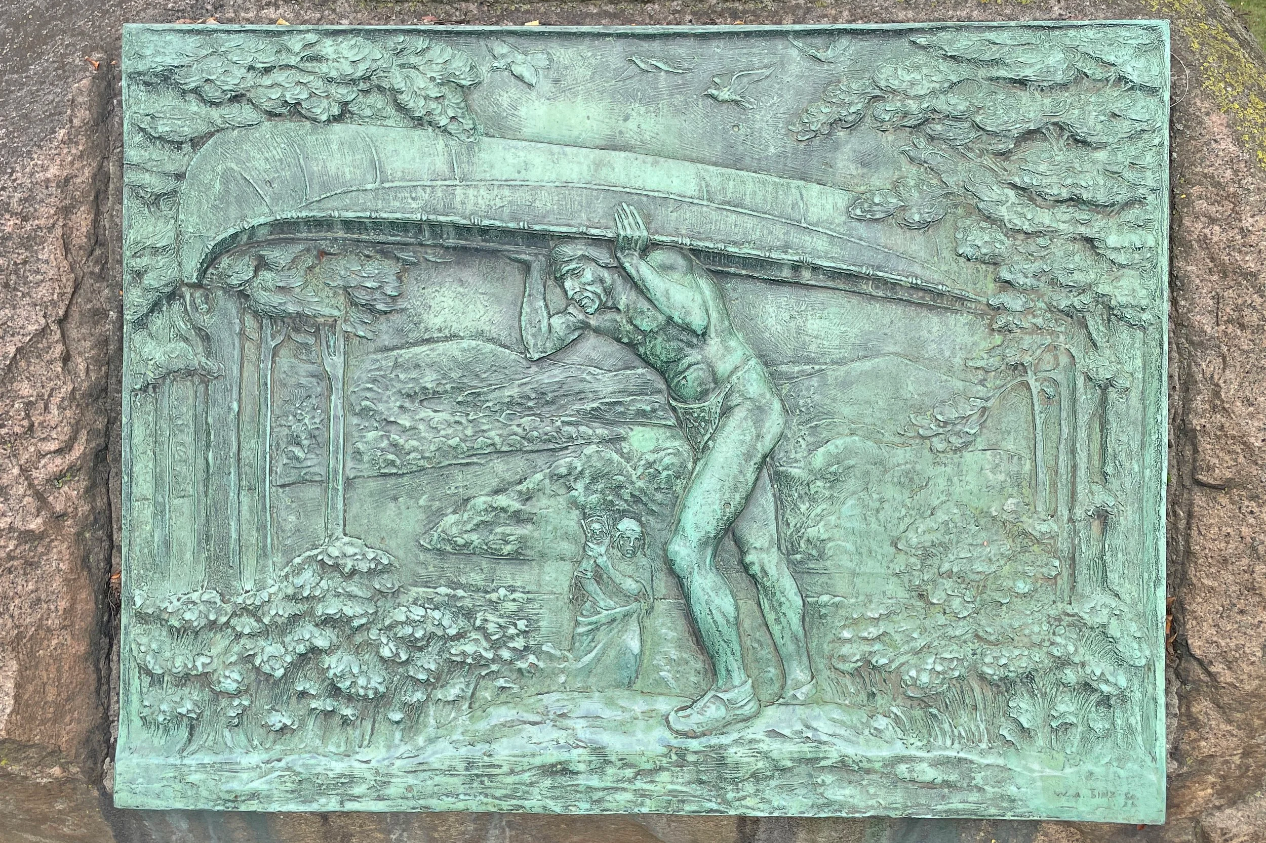 Indian Portaging a Canoe