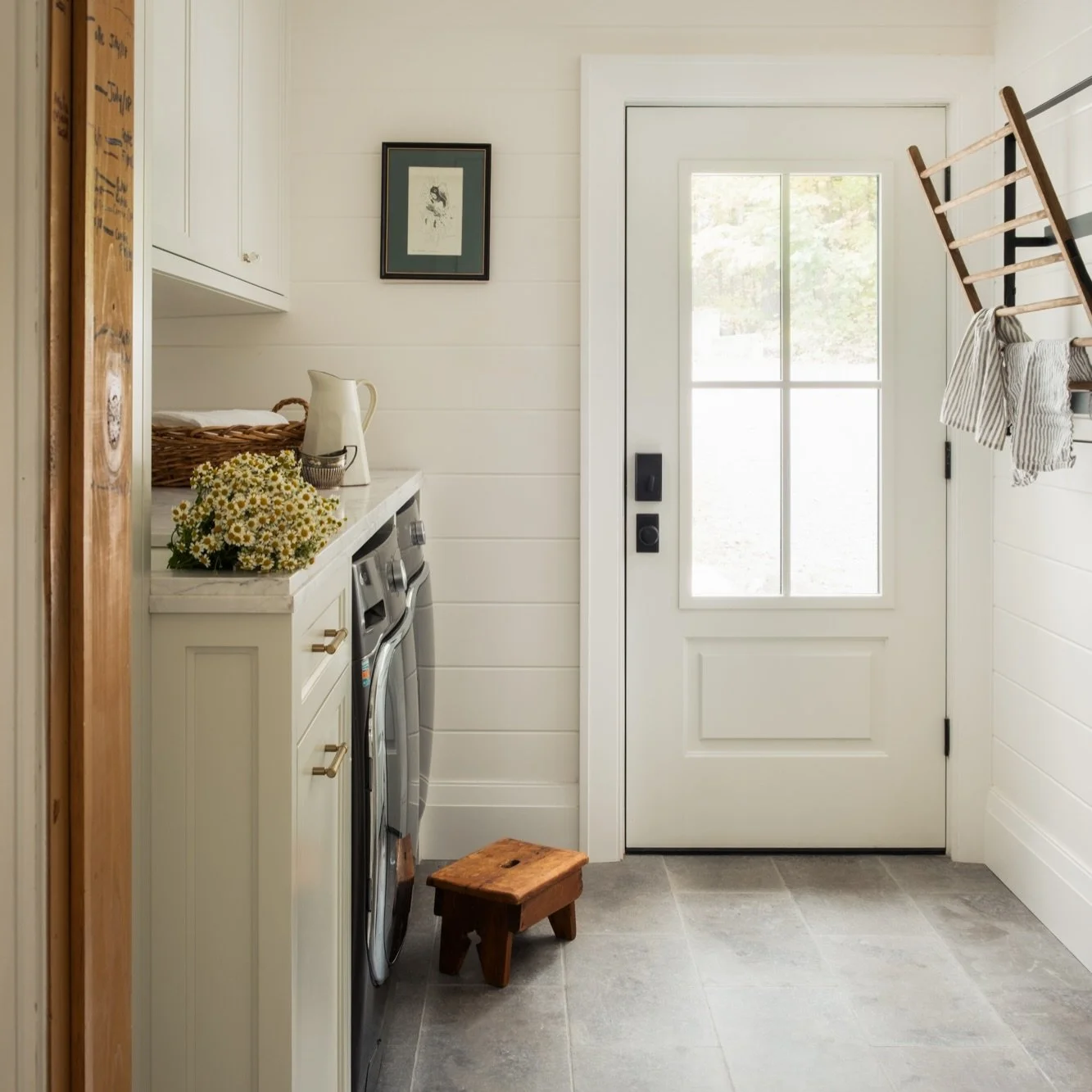 One of my favourite parts of the design process is getting to know the clients, their family, and the history already in their home. This laundry room is a perfect example of how we blend old and new. We kept years of kids&rsquo; height marks and tho