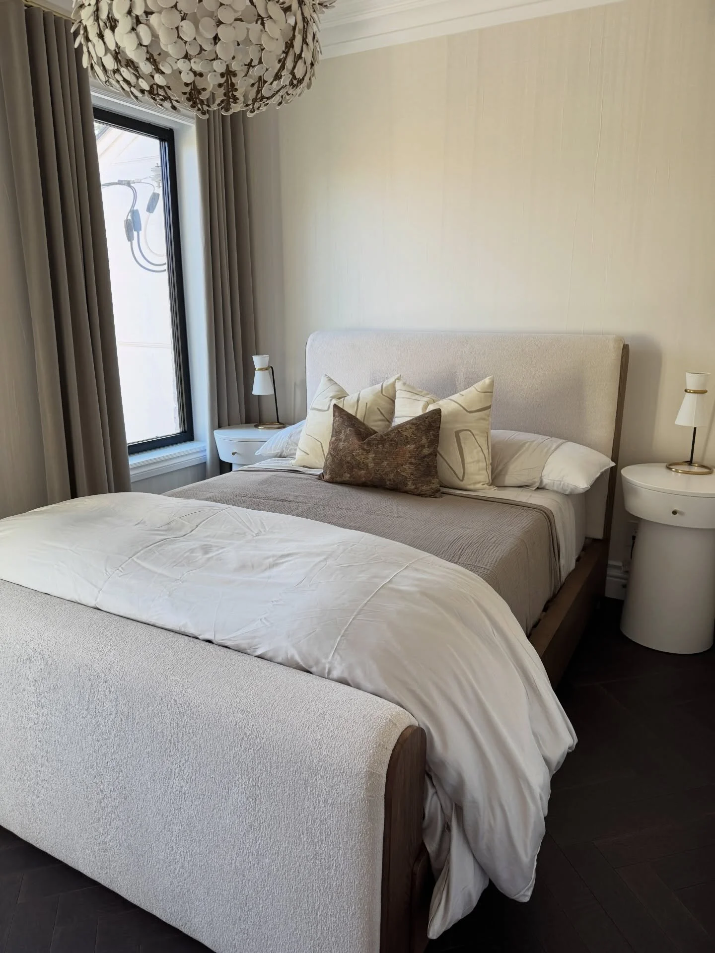 Project Bathurst 

The client wanted to keep this guest bedroom refresh relaxed and timeless, but we knew it needed a few playful moments to bring it to life - cue the chandelier peeking through and the custom nightstands. Sometimes going custom real