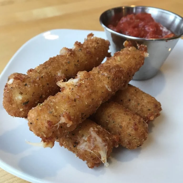 Made fresh in house, our hand battered mozzarella sticks are made from locally produced mozzarella cheese.&nbsp; We deep fry them to a perfect golden brown and serve them with a side of red sauce for dipping.&nbsp; Enjoy!  $8.75