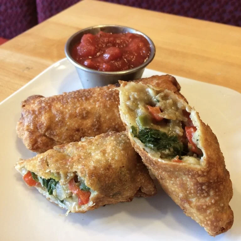 Hand-stuffed with spicy Italian sausage, organic bell peppers, organic spinach, organic red onion, locally produced mozzarella cheese, and then deep fried to perfection. Served with a side of red sauce.$8.75