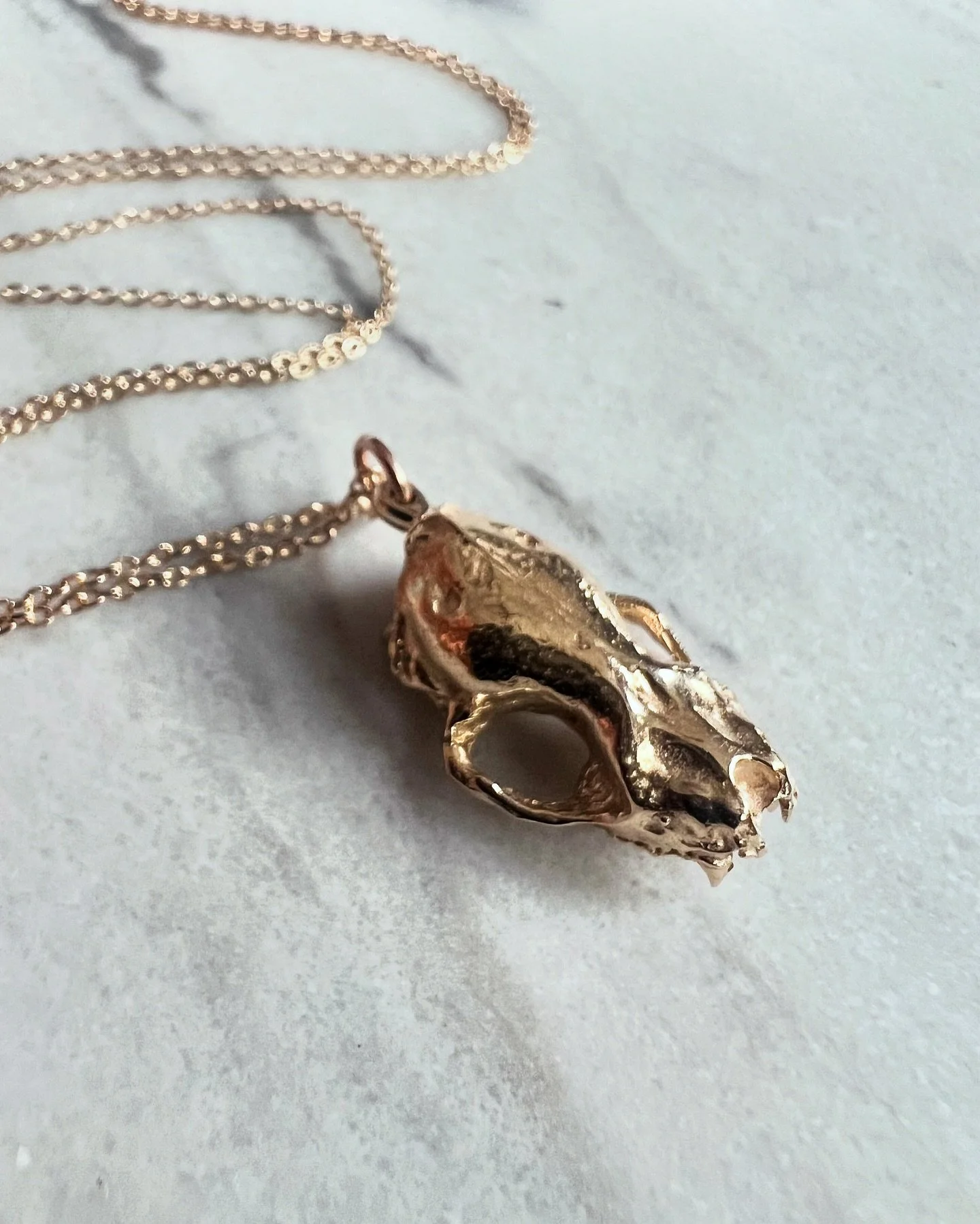 14k solid gold bat skull available now at theresaapplegate.com