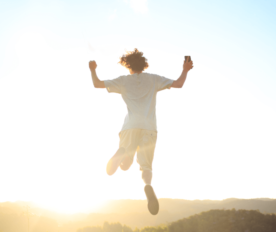 InHouse Pilates blog The benefits of being active image woman jumping for joy.