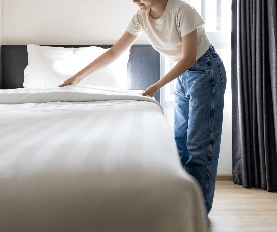 InHouse Pilates blog The benefits of being active image woman making her bed.