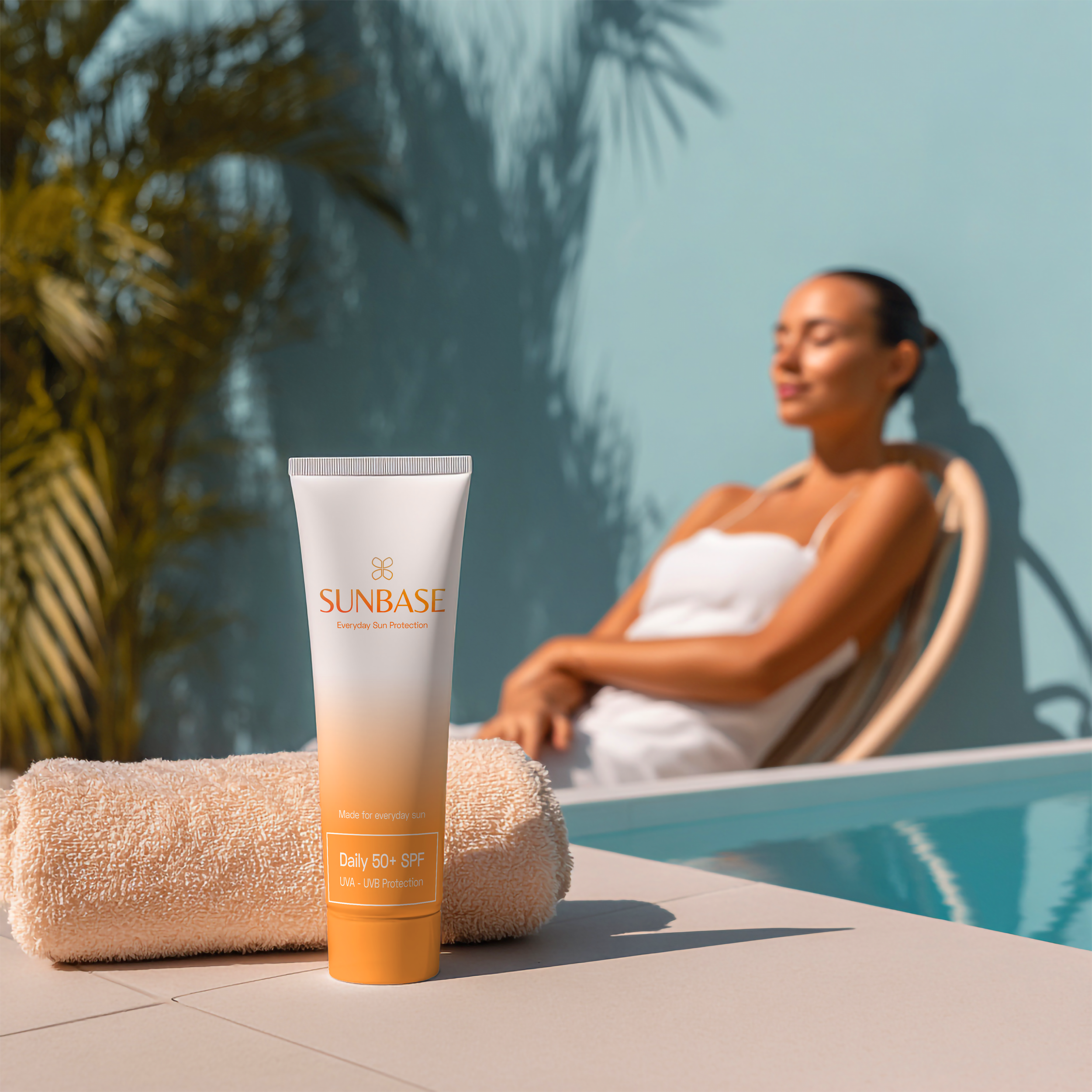 vecteezy_a-woman-relaxes-by-the-pool-with-a-tube-of-lotion-and-a-towel_77738070.png