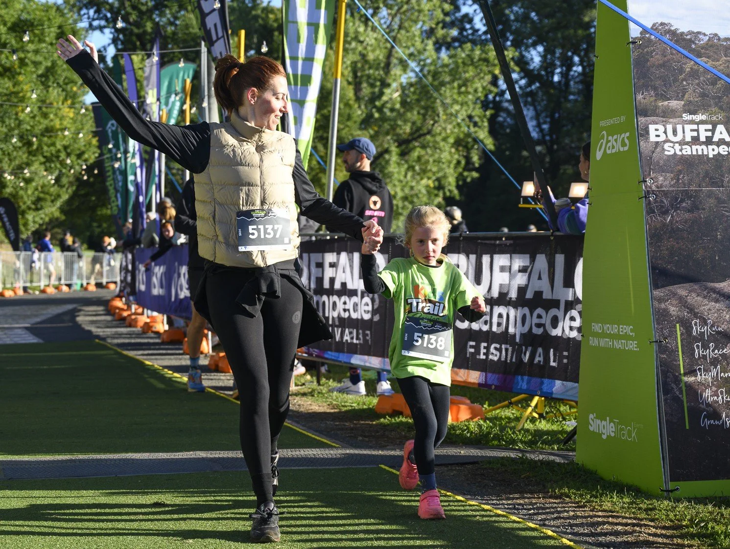 Julie and Billie, Luke's wife and daughter running in their 1st trail adventure, doing hard things together.