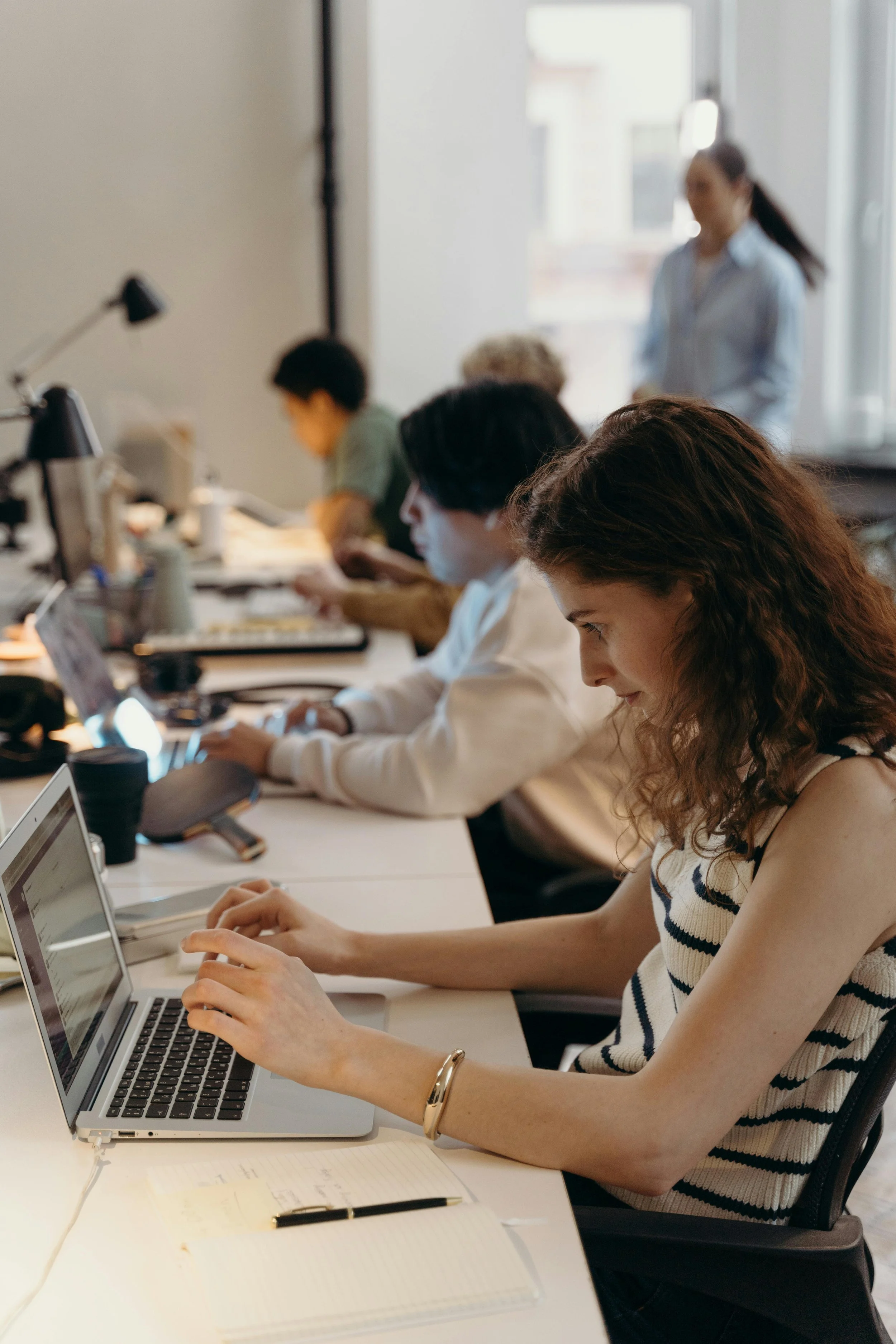 Team member working at desk, improving habits at work