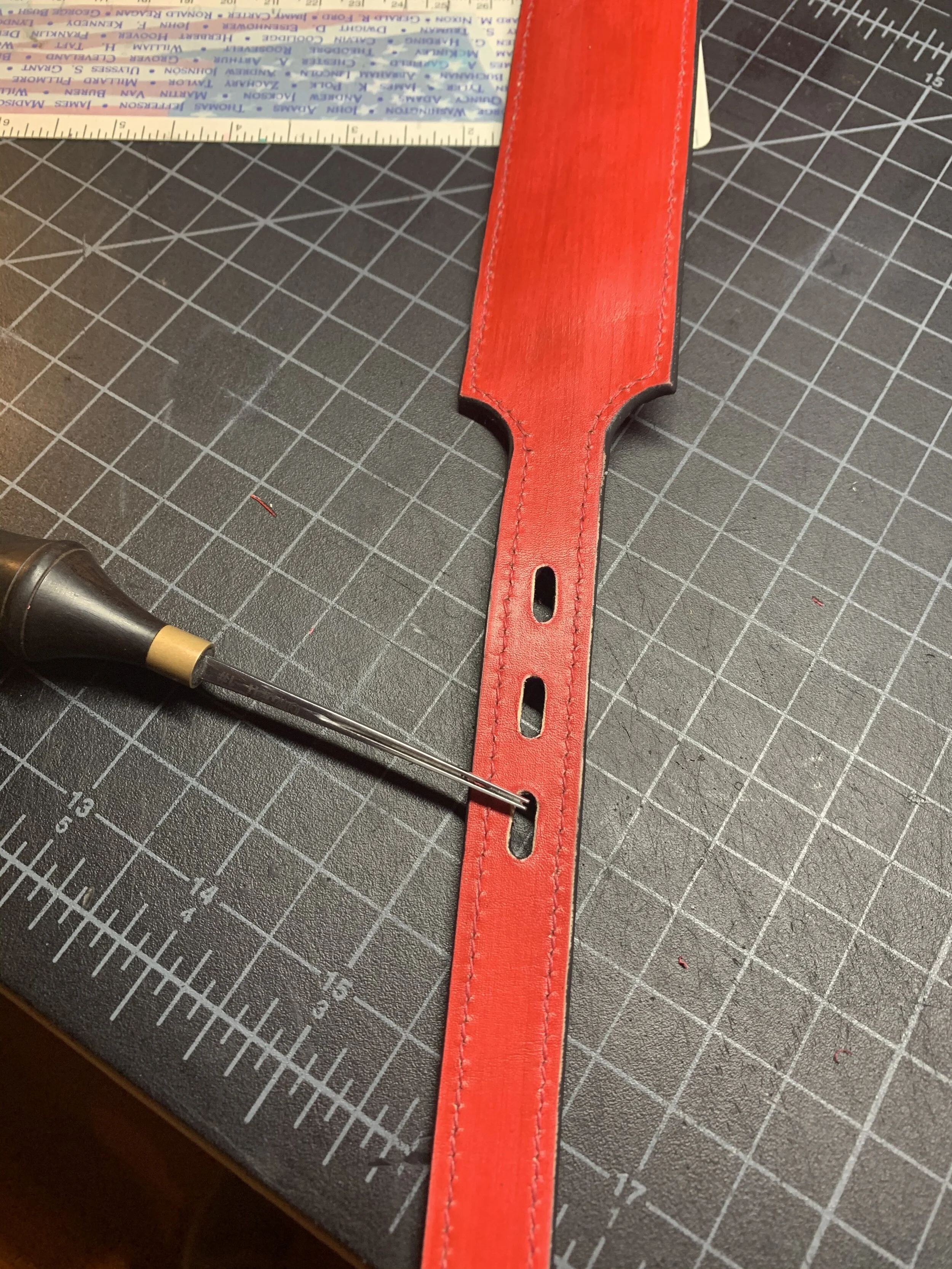 Edging the buckle holes before painting.