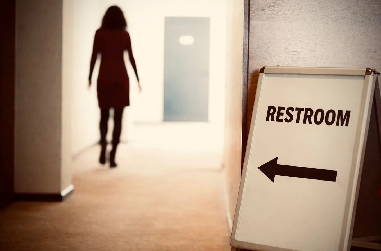 A public restroom is a choke point.

A choke point is any space that limits movement and funnels people through a narrow area, reducing options for entry and exit. 

Bathrooms are designed this way by default. Most have a single entrance and exit, wh