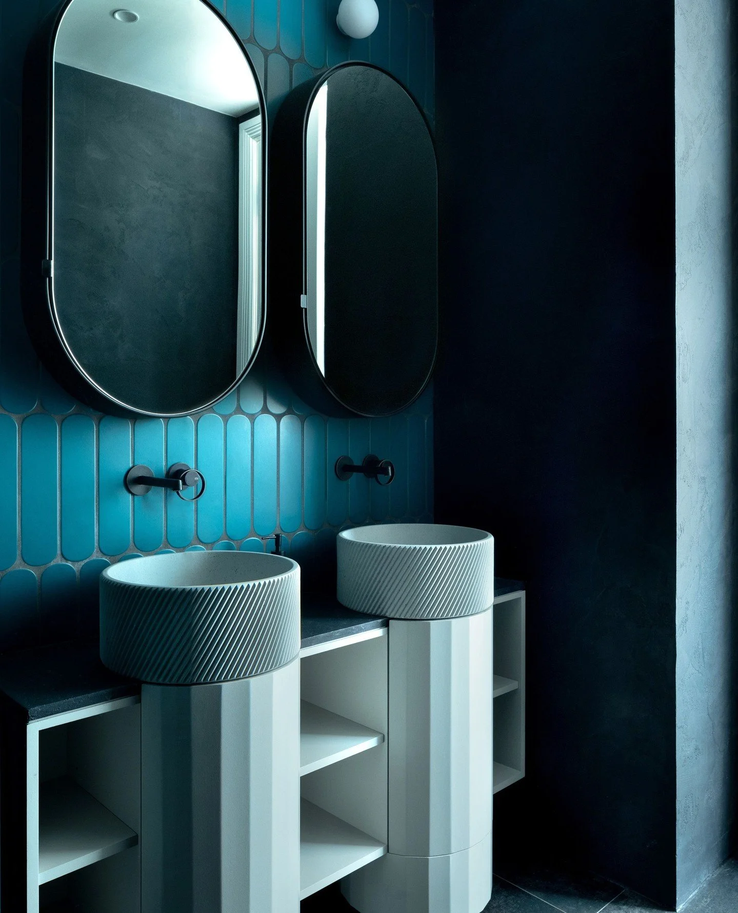 A study in depth and contrast 🩵⁠
⁠
Rich colour, soft surfaces and sculptural forms come together to create a bathroom that feels deeply immersive.⁠
⁠
At its centre, our Otto basin in 'Duck Egg' adds rhythm and texture, grounding the space with a sen