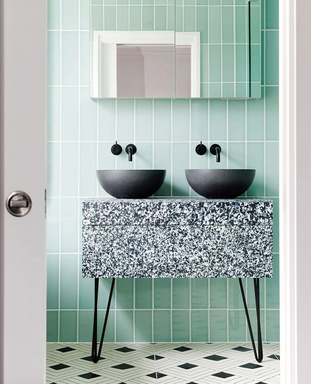 Easygoing balance 🫧🖤⁠
⁠
Cool mint tiles, graphic patterns and soft curves. Our Rena basins in black sit comfortably at the heart of a quietly confident space; grounded, tactile and easy to live in.⁠
⁠
Design @2lgstudio⁠
📸 @megantaylorphoto⁠
⁠
🎨 A