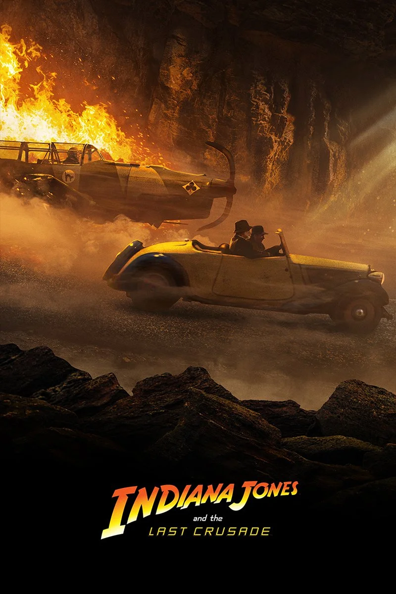An action scene from Indiana Jones featuring a miniature car speeding through a rugged terrain with a fiery explosion in the background.