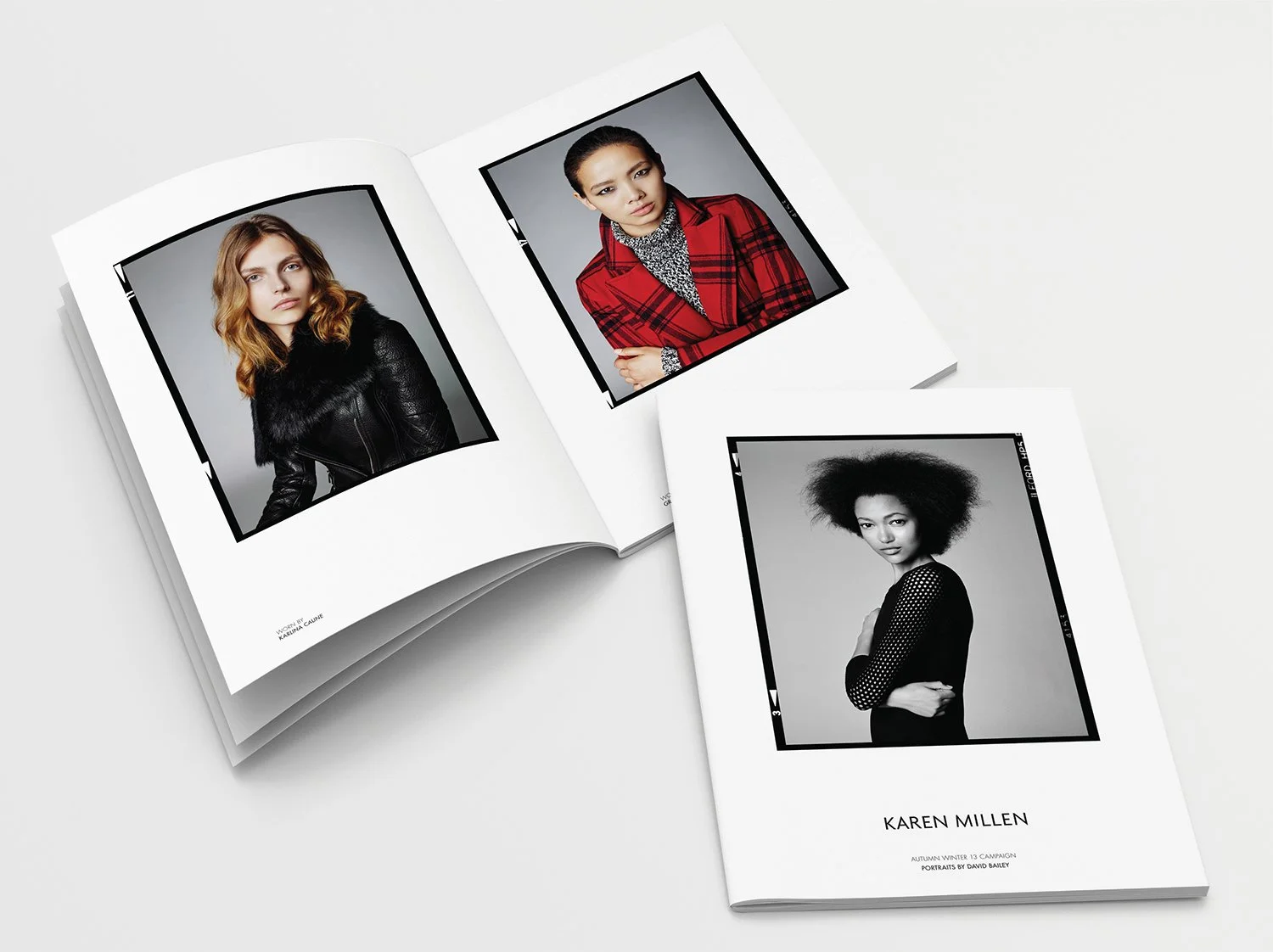 Open magazine featuring portraits of three women with diverse styles, one in a black leather jacket, another in a red plaid blazer, and a third in a black and white outfit with an Afro hairstyle.