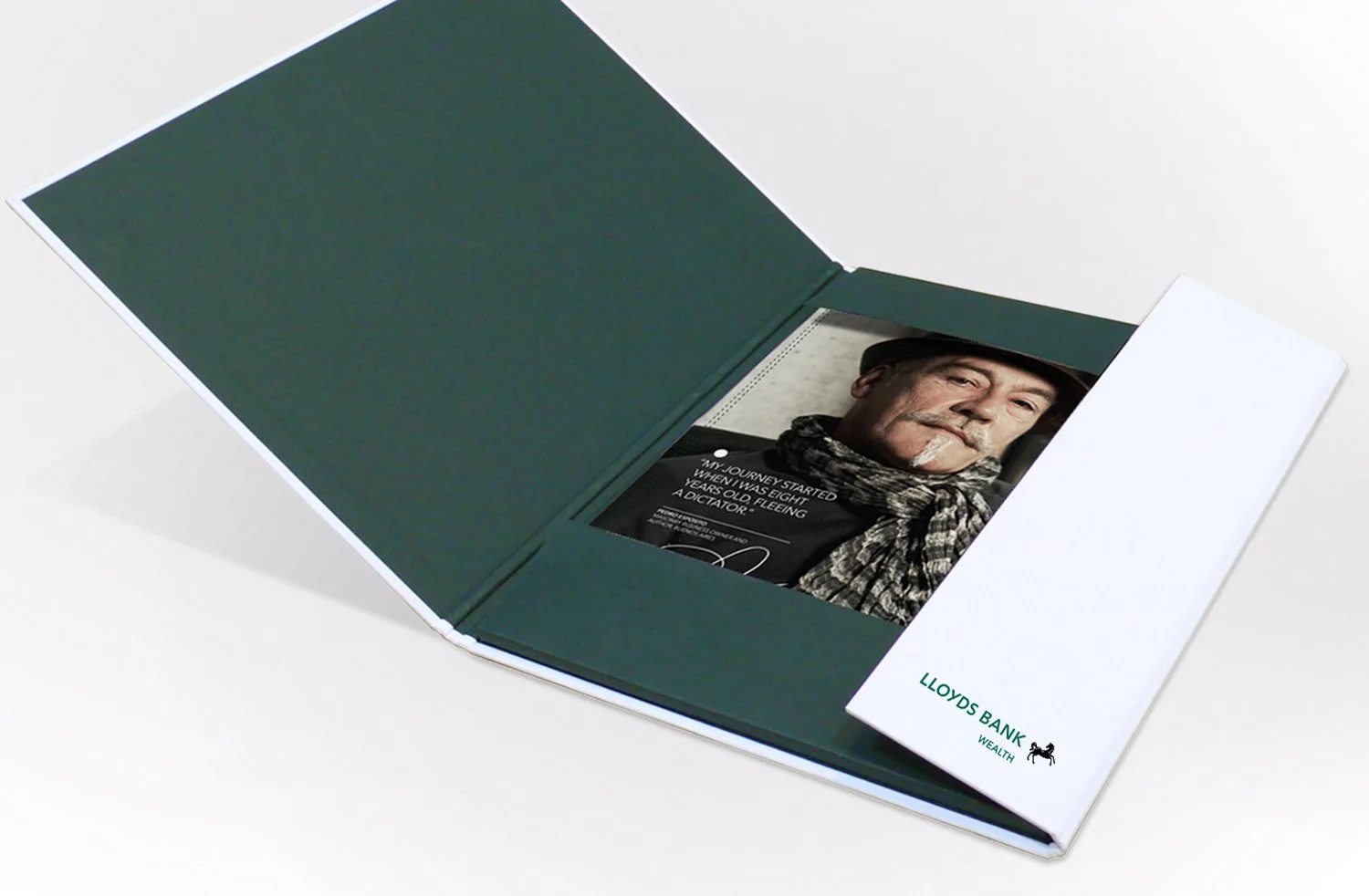 Open brochure featuring Lloyds Bank Wealth with a portrait of a man wearing a black hat and scarf inside.