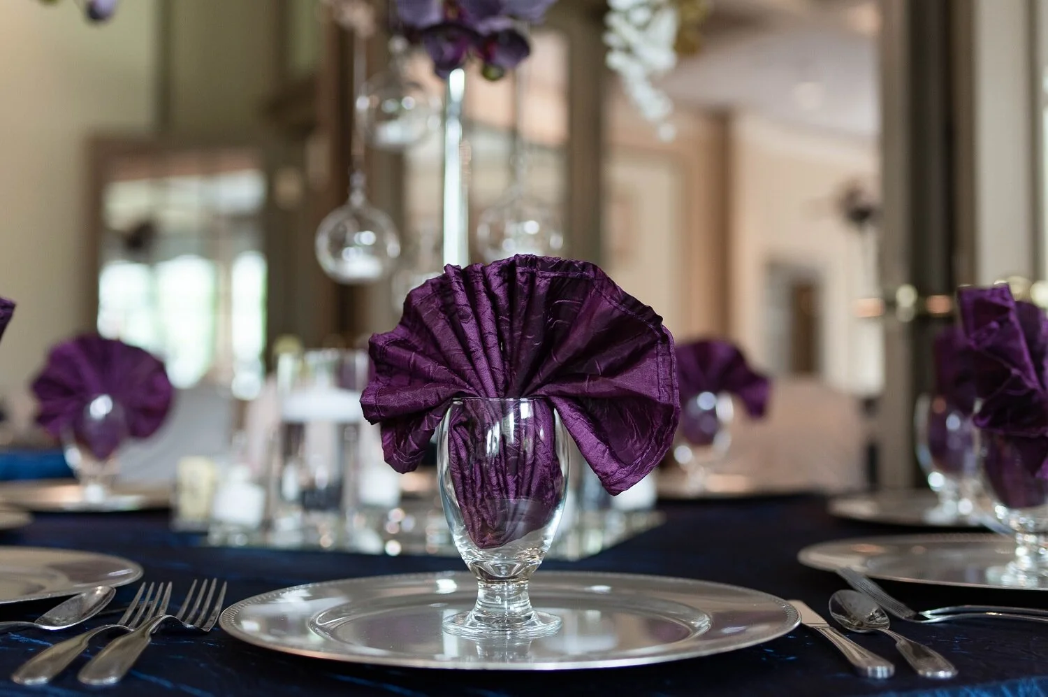 guest-table-place-setting-with-fancy-eggplant-crushed-taffeta-napkin