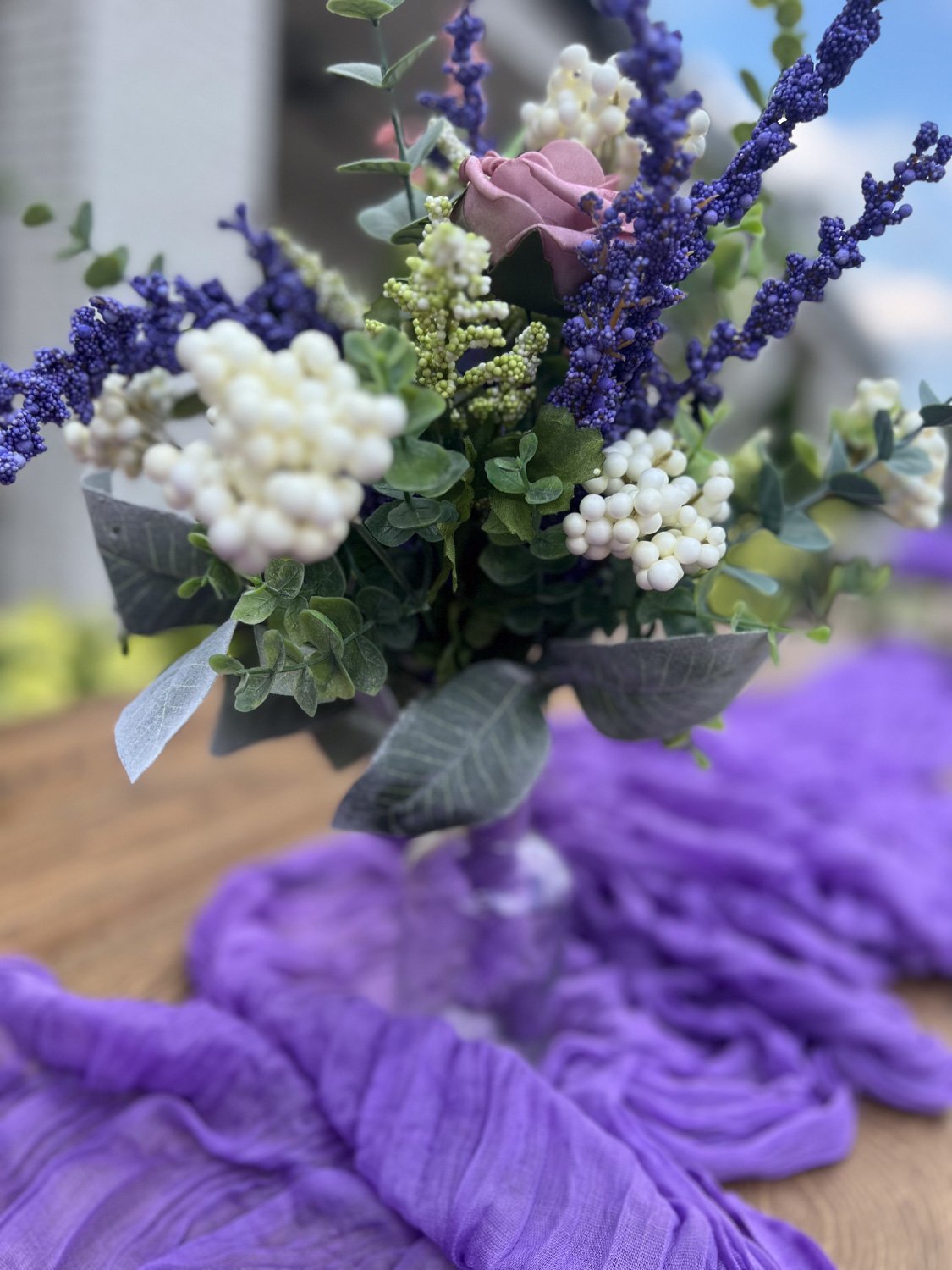 Elegant-purple-themed-floral-centerpiece-for-wedding.jpg