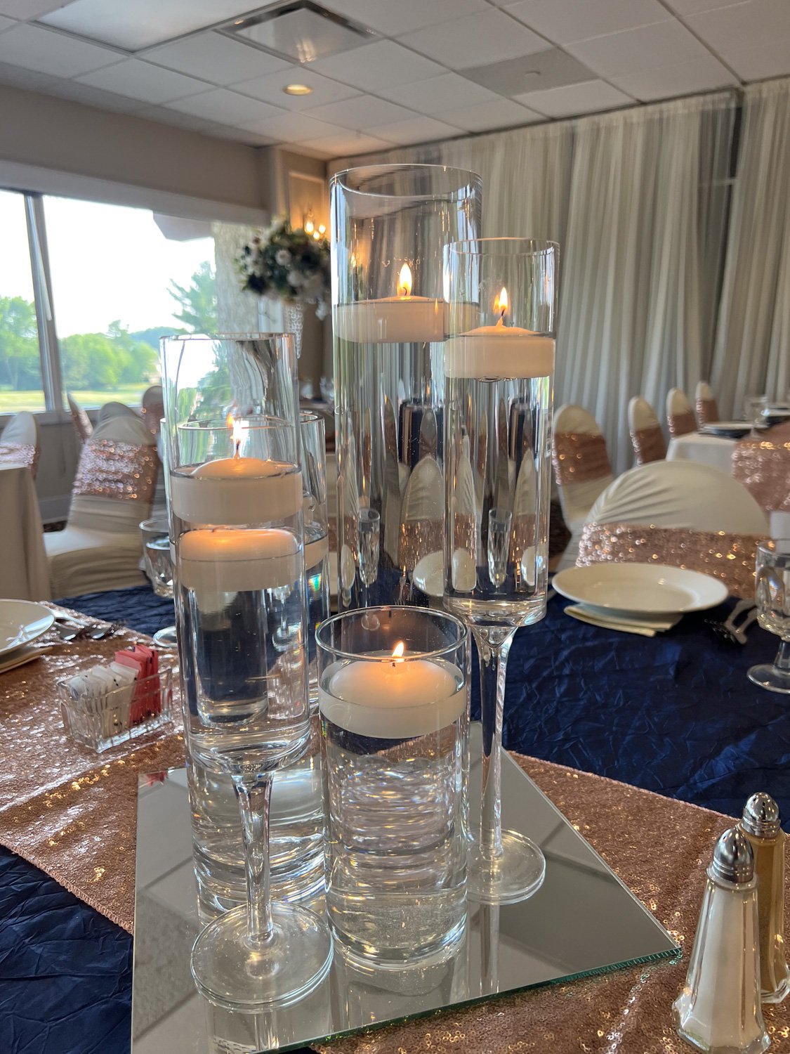 Elegant-lighted-candle-in-glasses-centerpieces.jpg