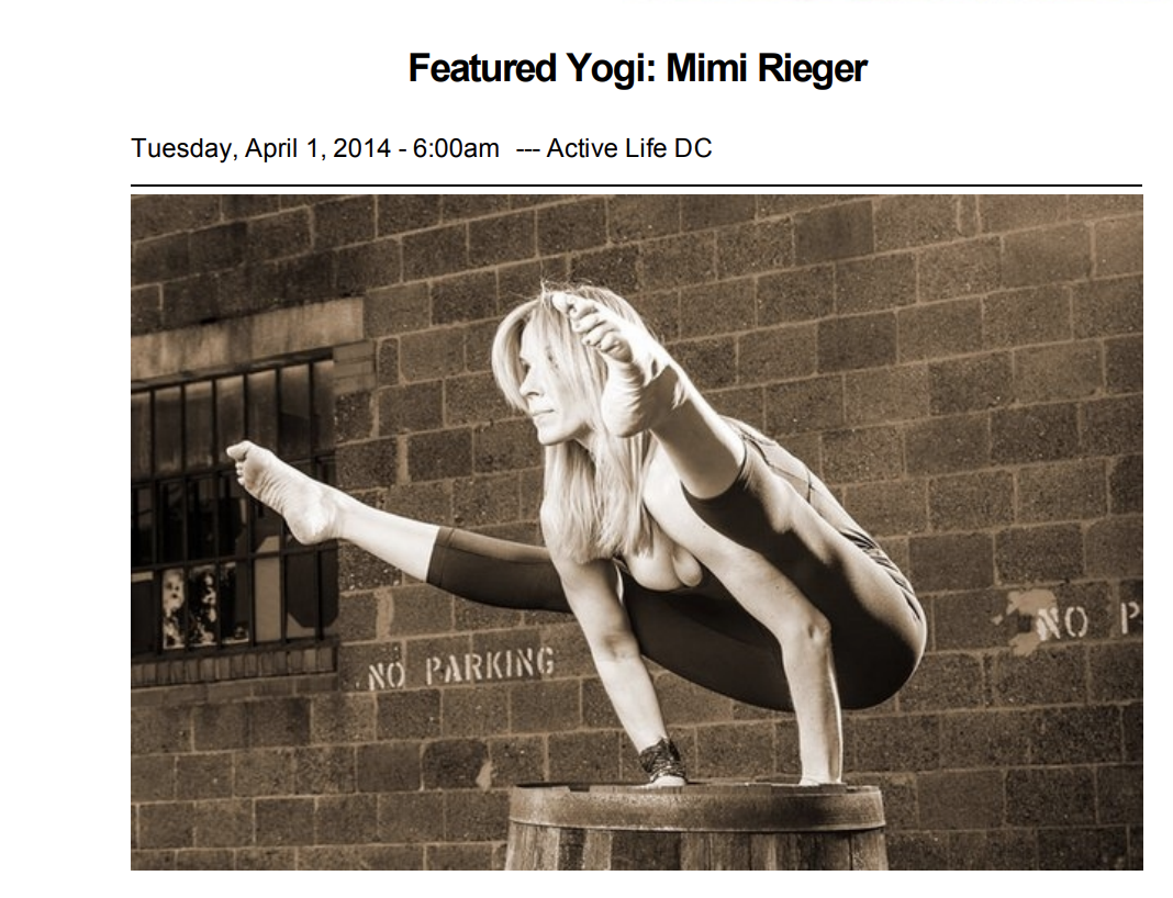 A woman practices yoga on a platform in front of a brick wall with a window, performing a balancing pose with one hand on the platform and the other hand holding her foot behind her head, in a sepia tone.