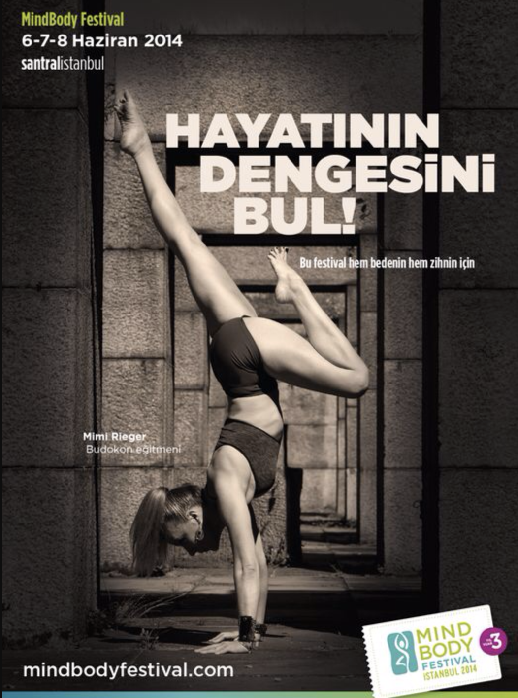 Black and white poster for the MindBody Festival held on June 6-8, 2014, in Istanbul. The poster shows a woman doing a handstand against a textured wall. Text in Turkish promotes balancing life and mind, with details of the event, location, and website at the bottom.