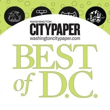 Logo for Washington City Paper with text 'Best of D.C.' and icons of a rocking chair, a bench, a hammock, and a small house or van, all on a green background with circular patterns.