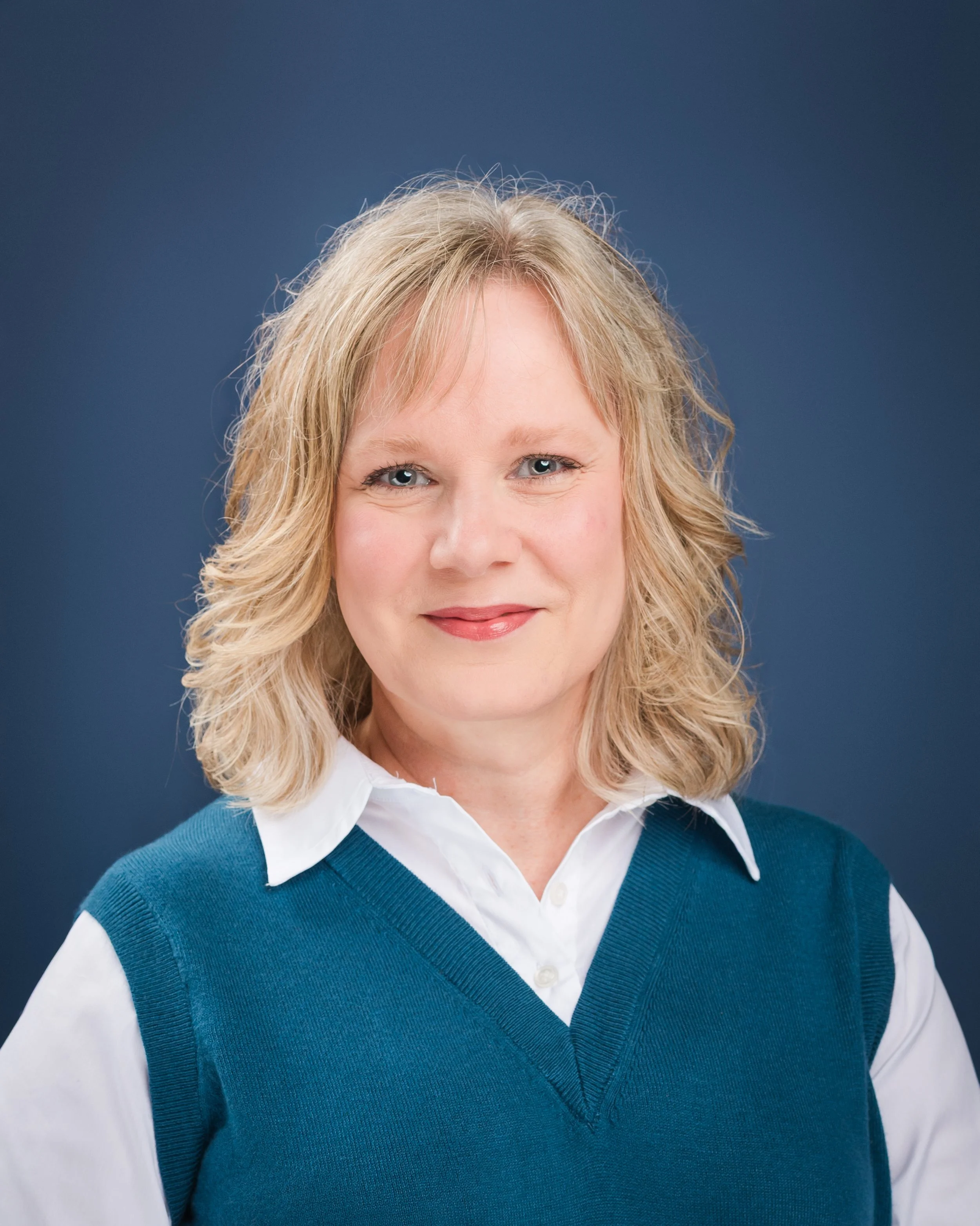 Woman seeing her professional headshots for the first time during a brand photography session in Bloomington Normal Illinois