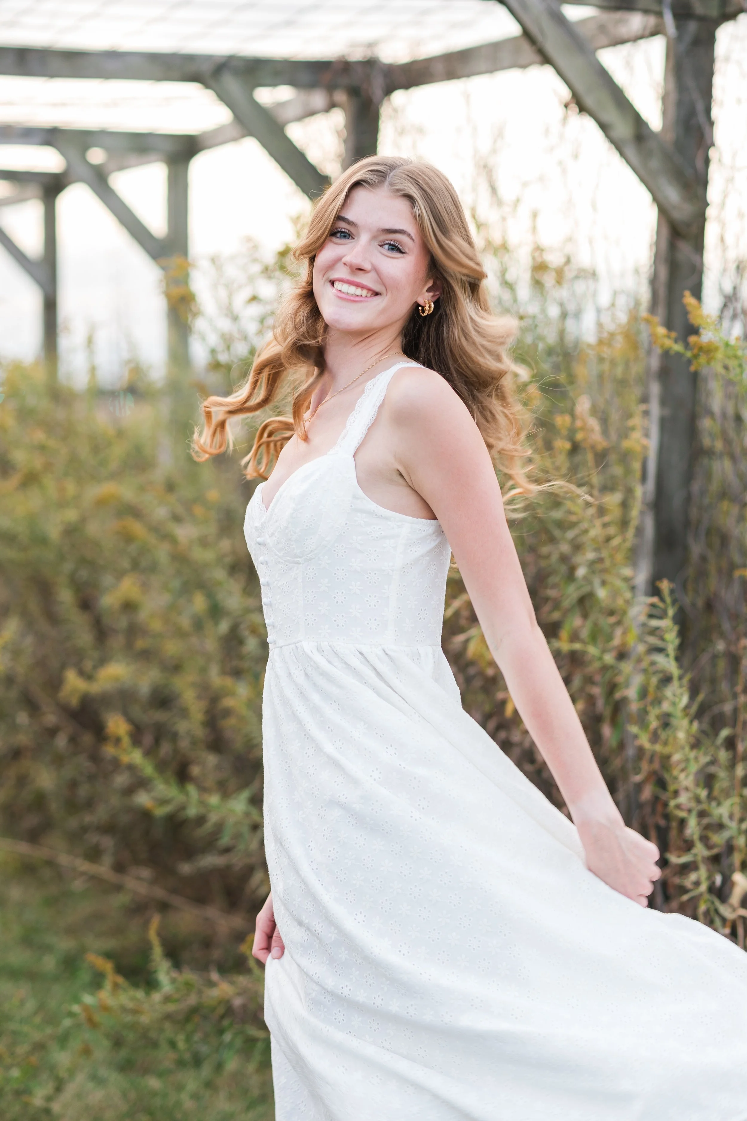 Candid senior portrait session at ISU Horticulture Center in Normal Illinois.