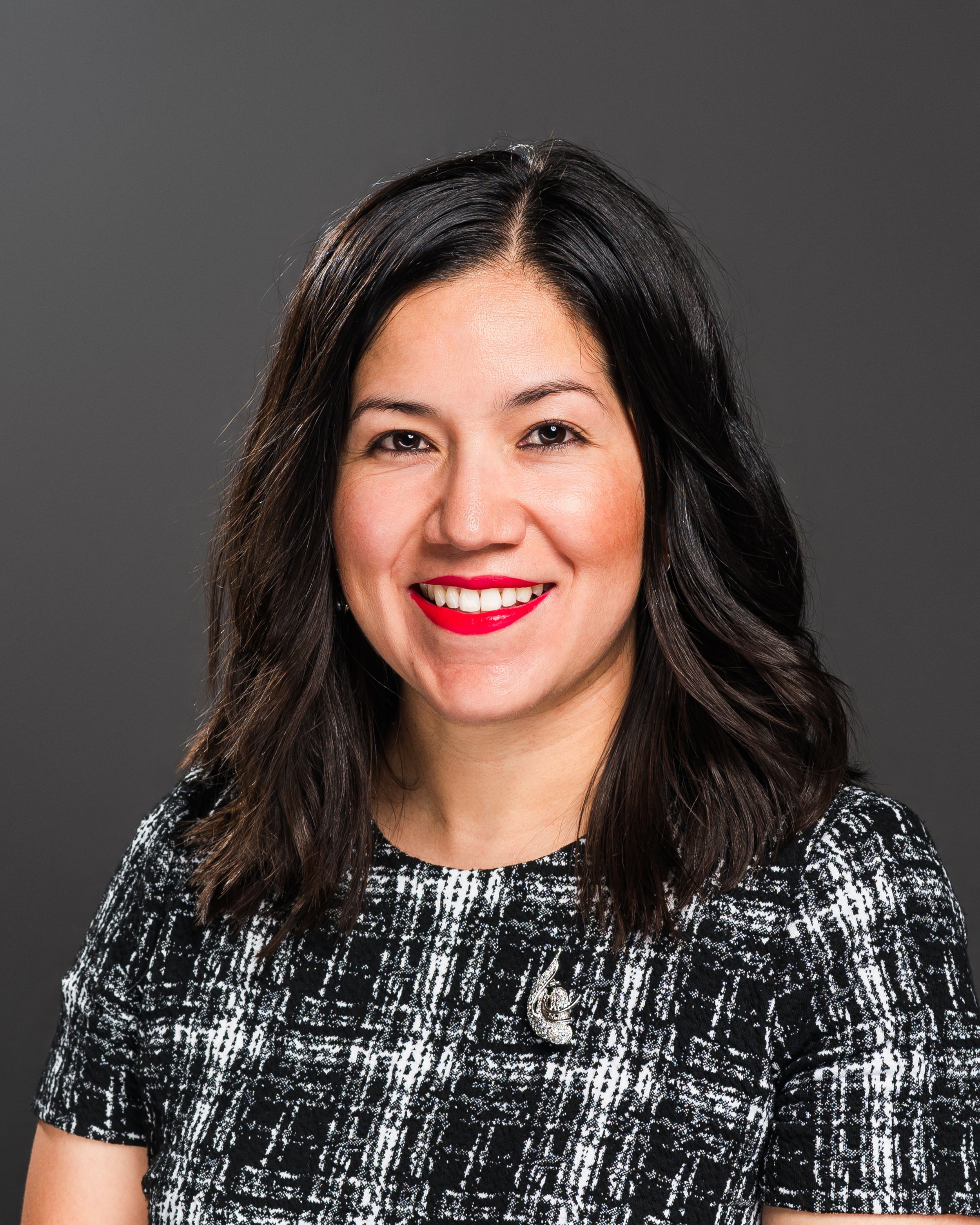 Relaxed business headshot taken in Bloomington-Normal office setting