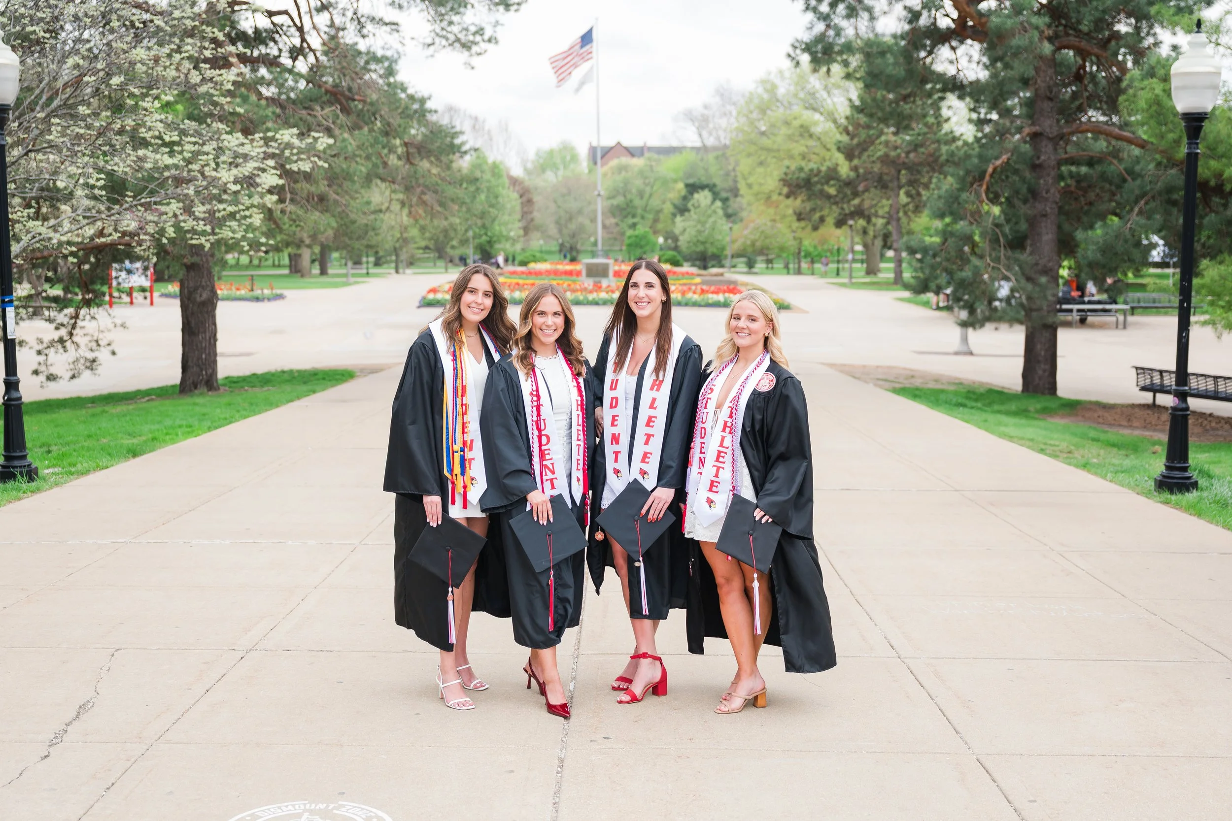 4 student athletes on the quad of Illinois state