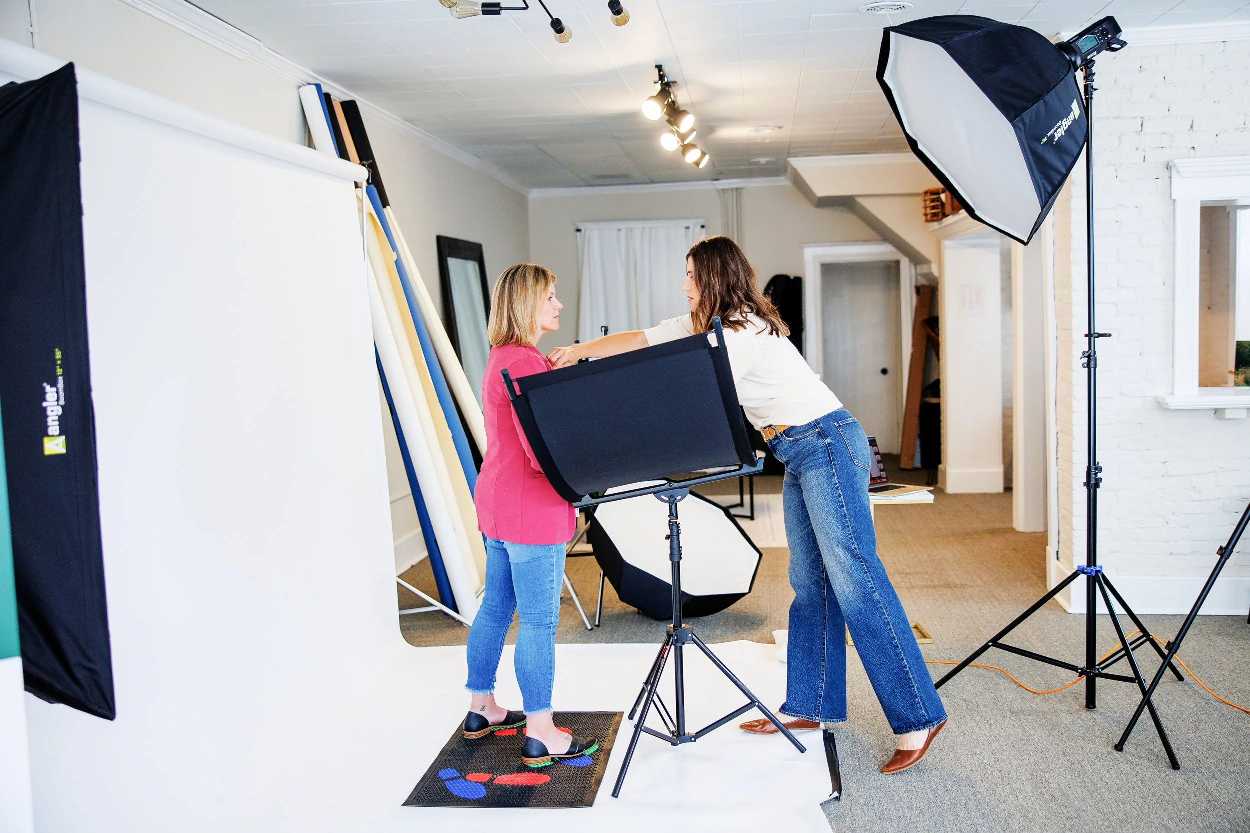 Behind the scenes at a professional headshot session with a brand photographer in Bloomington Illinois studio