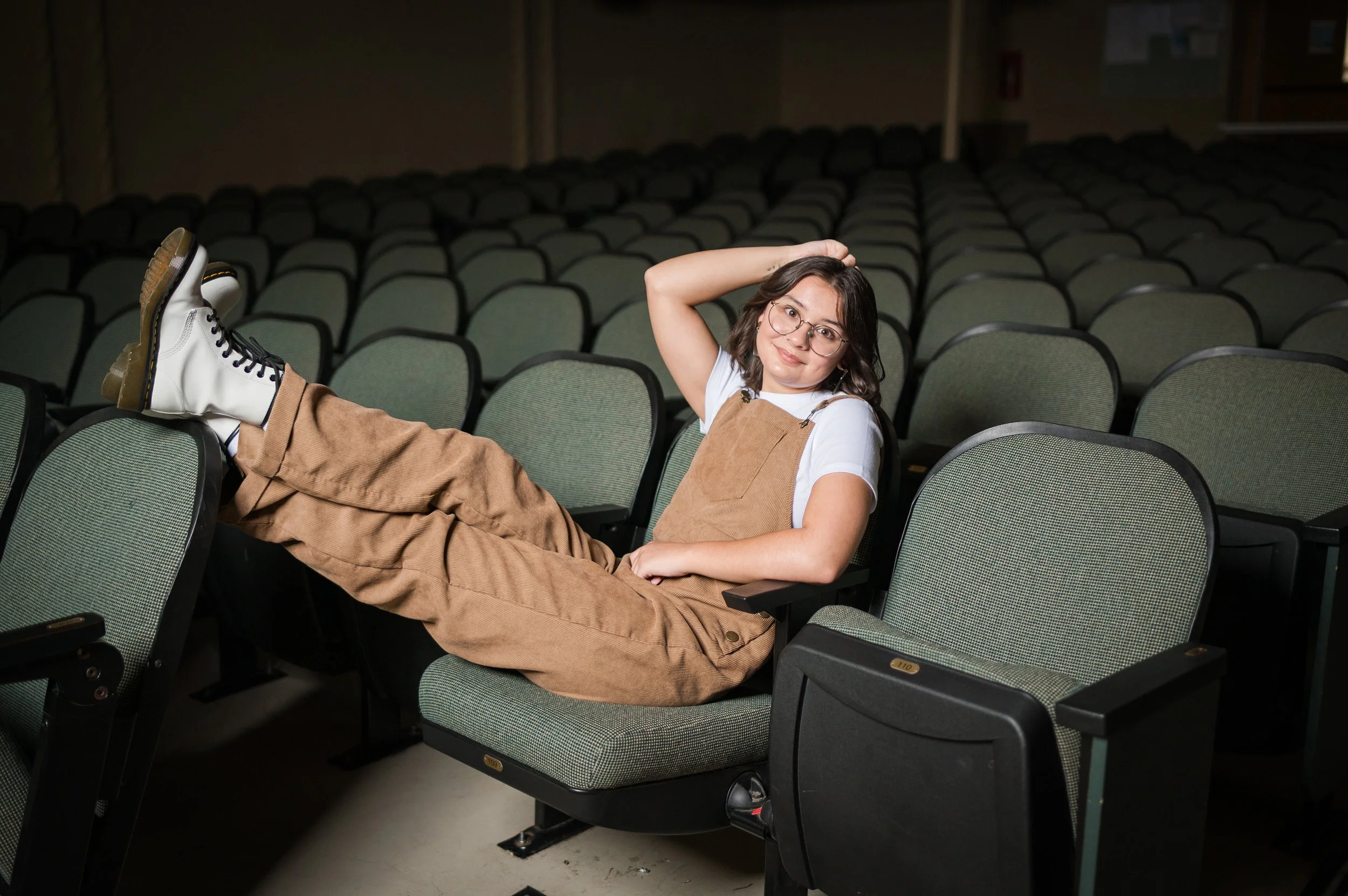 Professional senior portrait of a creative teen in Central Illinois on theater stage