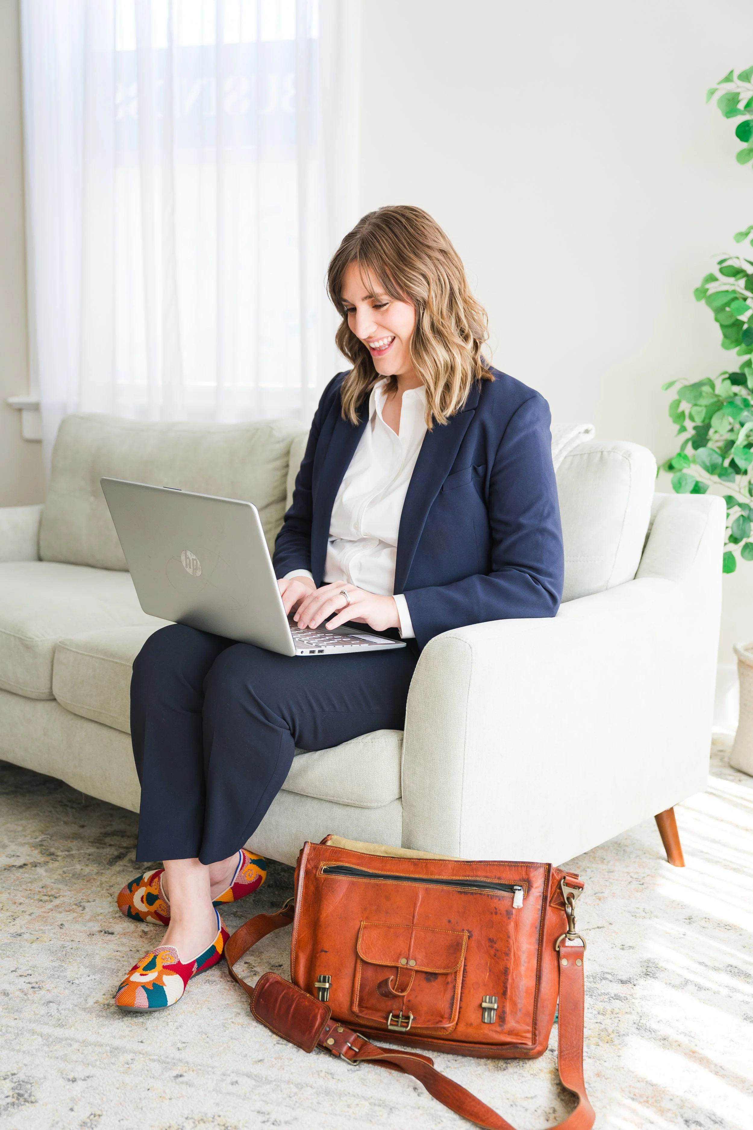 Bloomington Normal brand photographer captures a business owner confidently planning her online content.