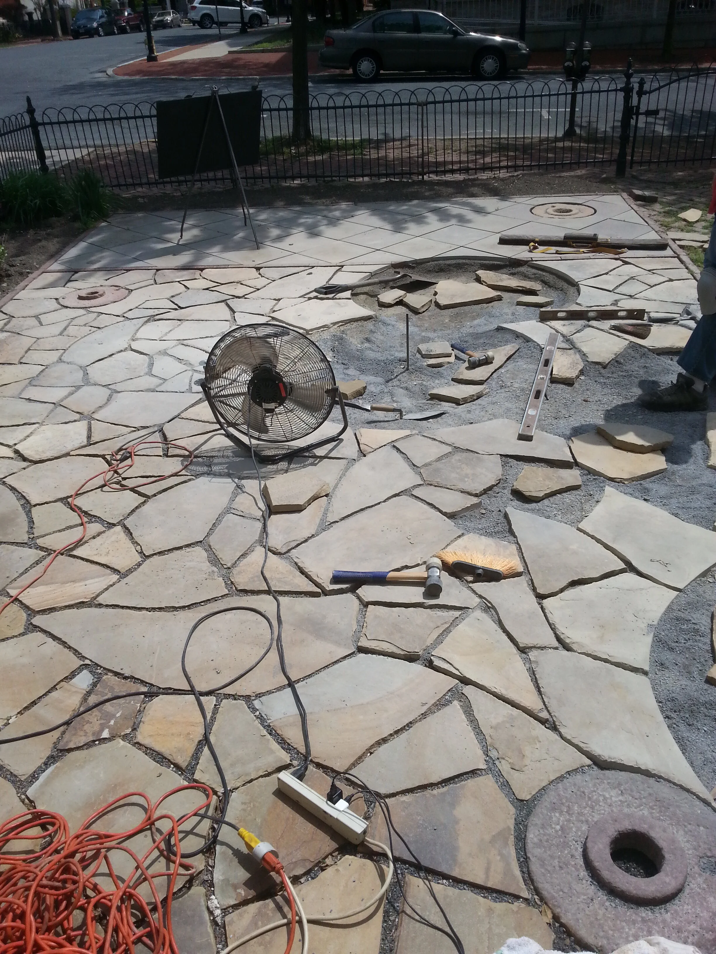 Custom stone patio with areas for plants by Steel and Stone — Designer