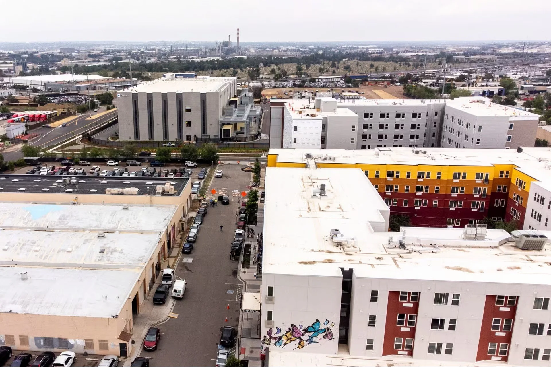 A CoreSite data center (top left) is under construction near the Viña apartments and future Viña Senior Residences building in Elyria Swansea. June 25, 2026. Kevin J. Beaty/Denverite