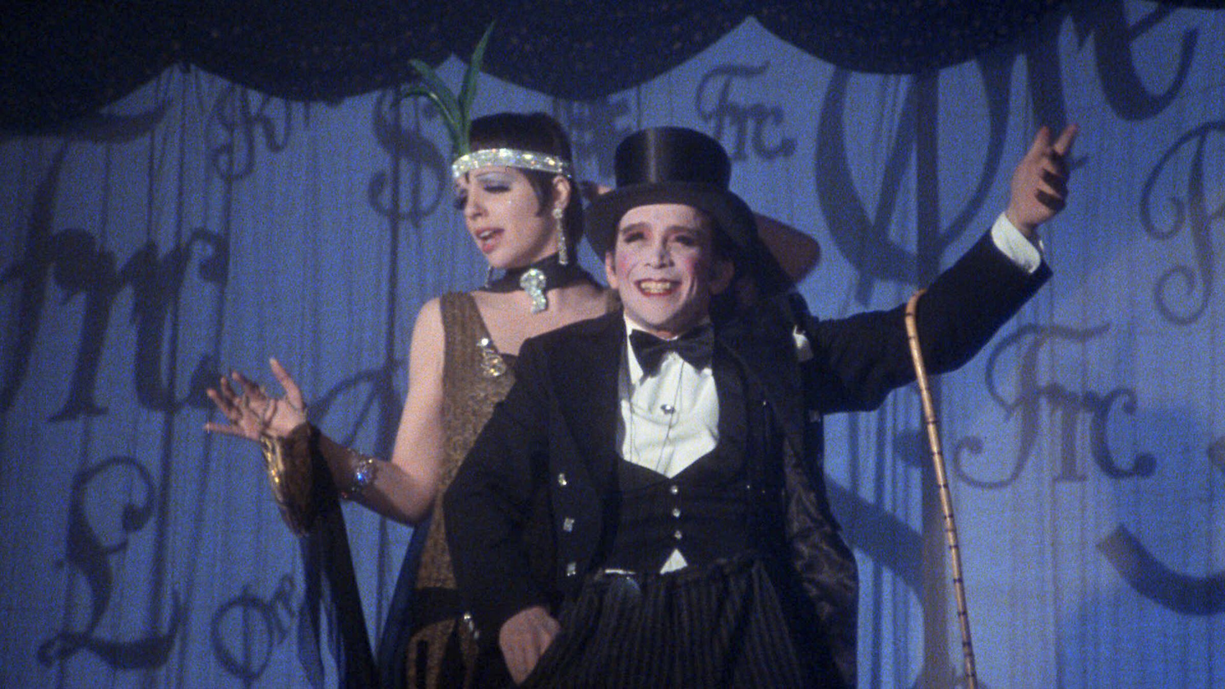 A still from the movie Cabaret with Sally and the Emcee performing onstage.