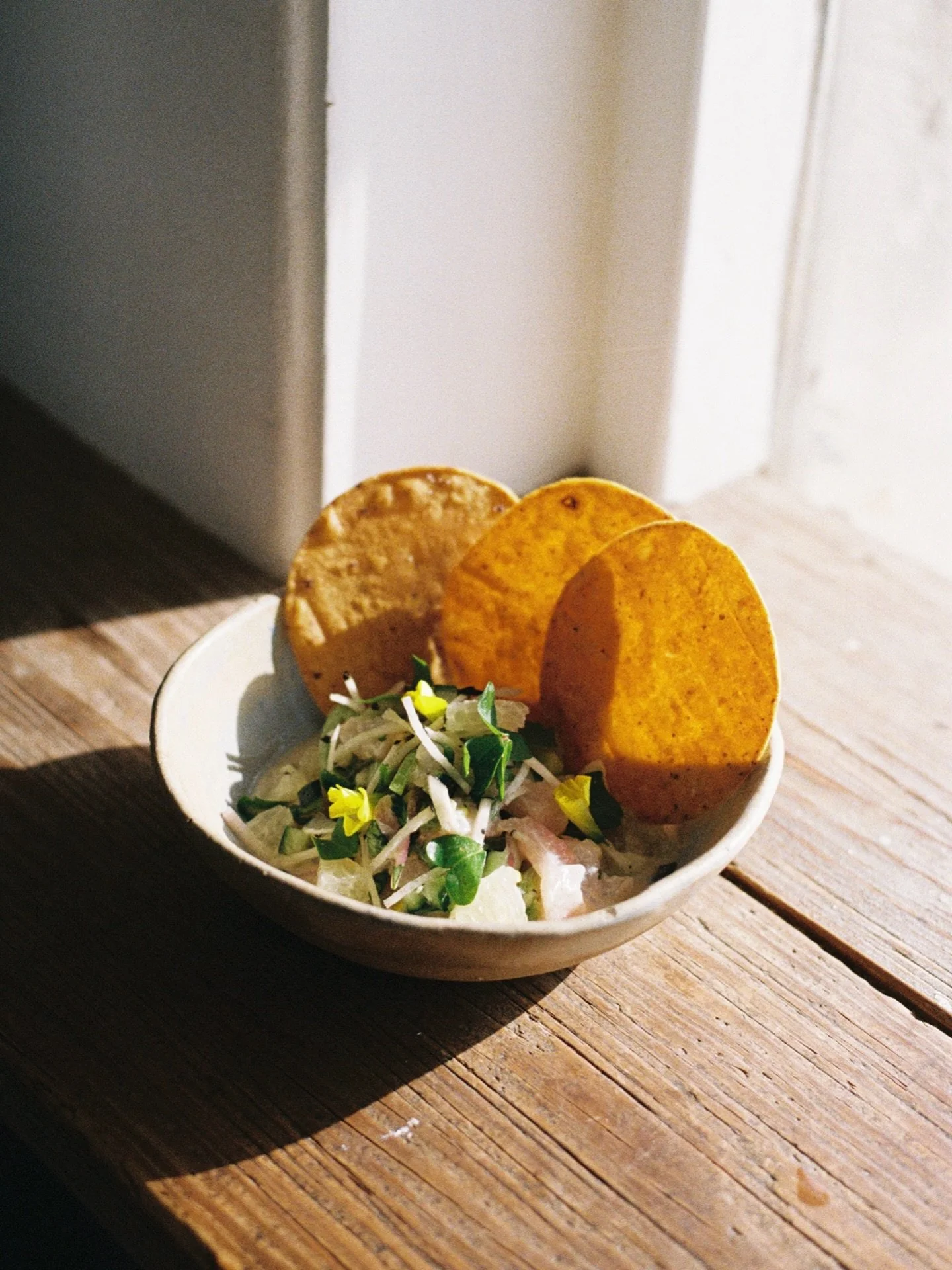 ceviche of the season - california rockfish, coconut leche de tigre, meyer lemon, oro blanco, sugar snap pea, sorrel, cilantro, serrano 🐟