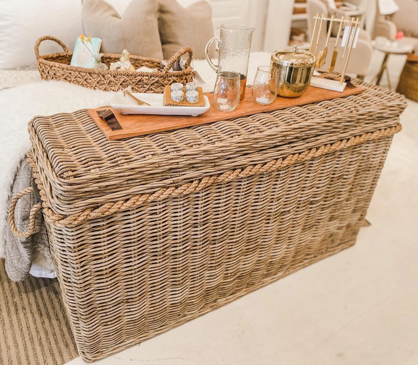 This Rattan Console is perfect for so many reasons but best of all it&rsquo;s a piece of furniture that can do double duty! Use it as a focal piece for serving drinks and snacks on a covered porch or patio then raise the lid and you have storage for 