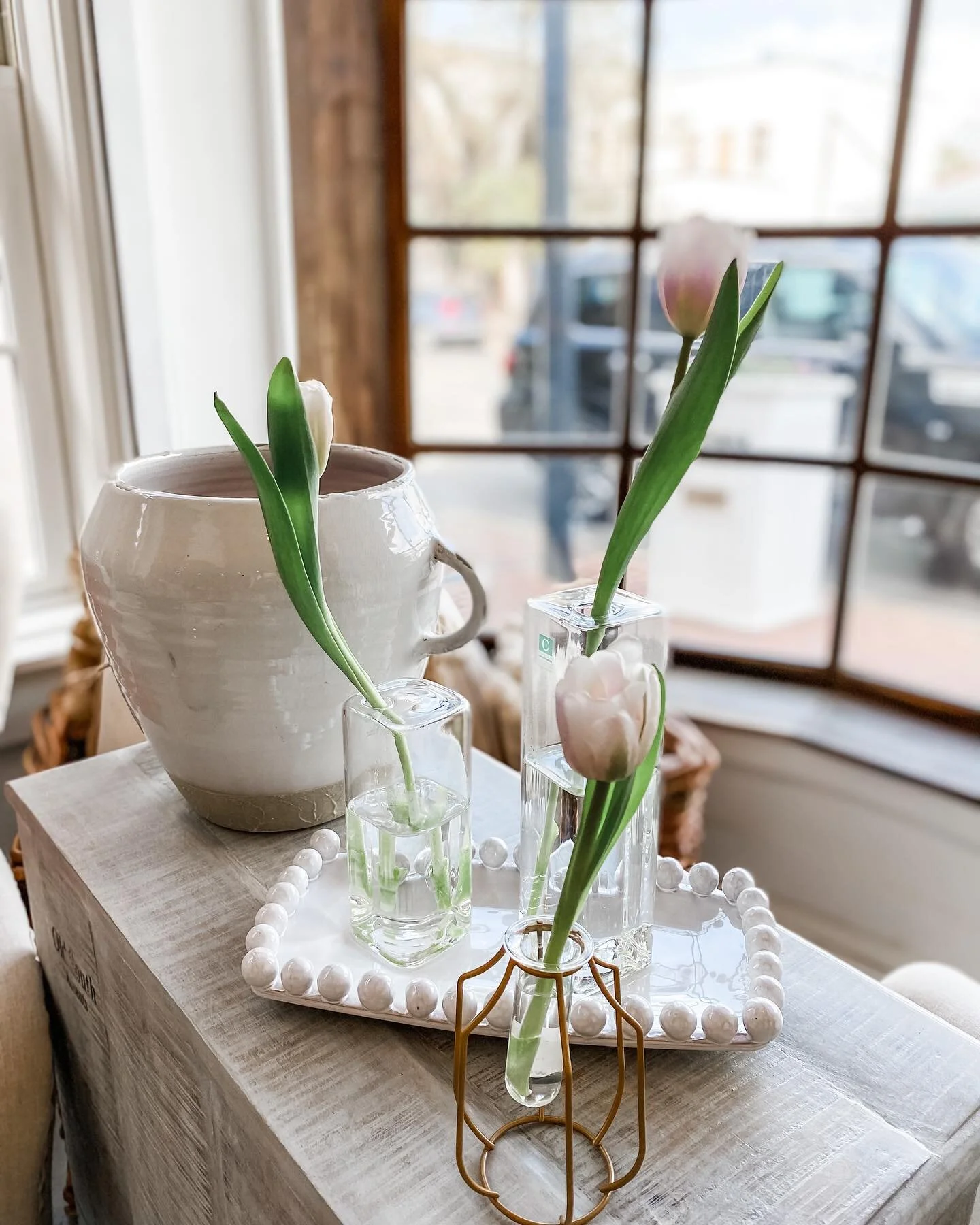 A grouping of simple vases makes a stunning statement on any table! Come see us today from 10-5:30 or shop us on the web at willowgrayhome.com! #simplevases #tableaccessories #moretulipsplease #shoplocal