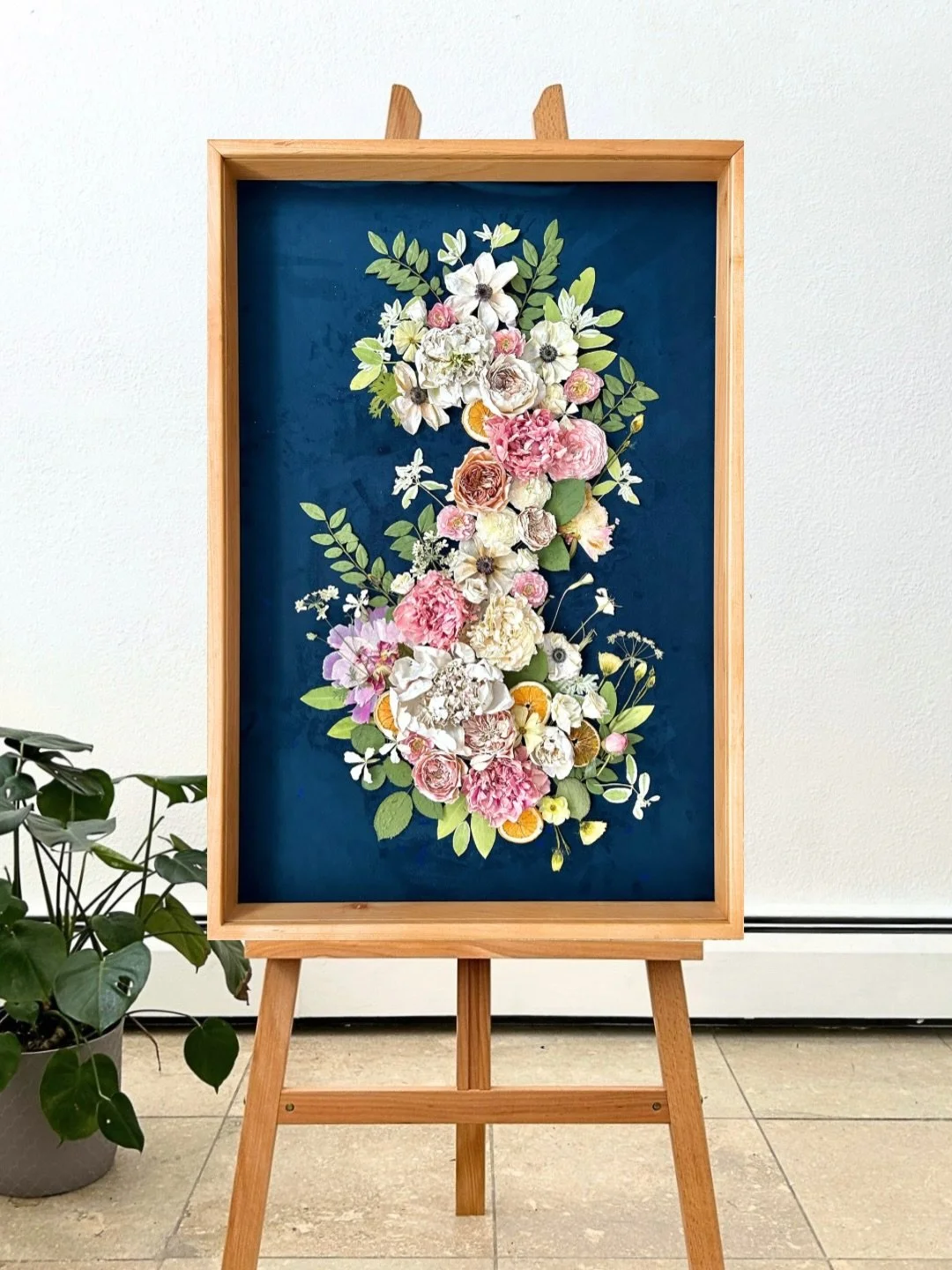 A true showstopper. This 24&rdquo; x 36&rdquo; preserved floral artwork is finished with museum-quality Masterpiece Acrylic, giving it incredible clarity, depth, and long-lasting protection. Every bloom is elevated, every detail preserved, designed t