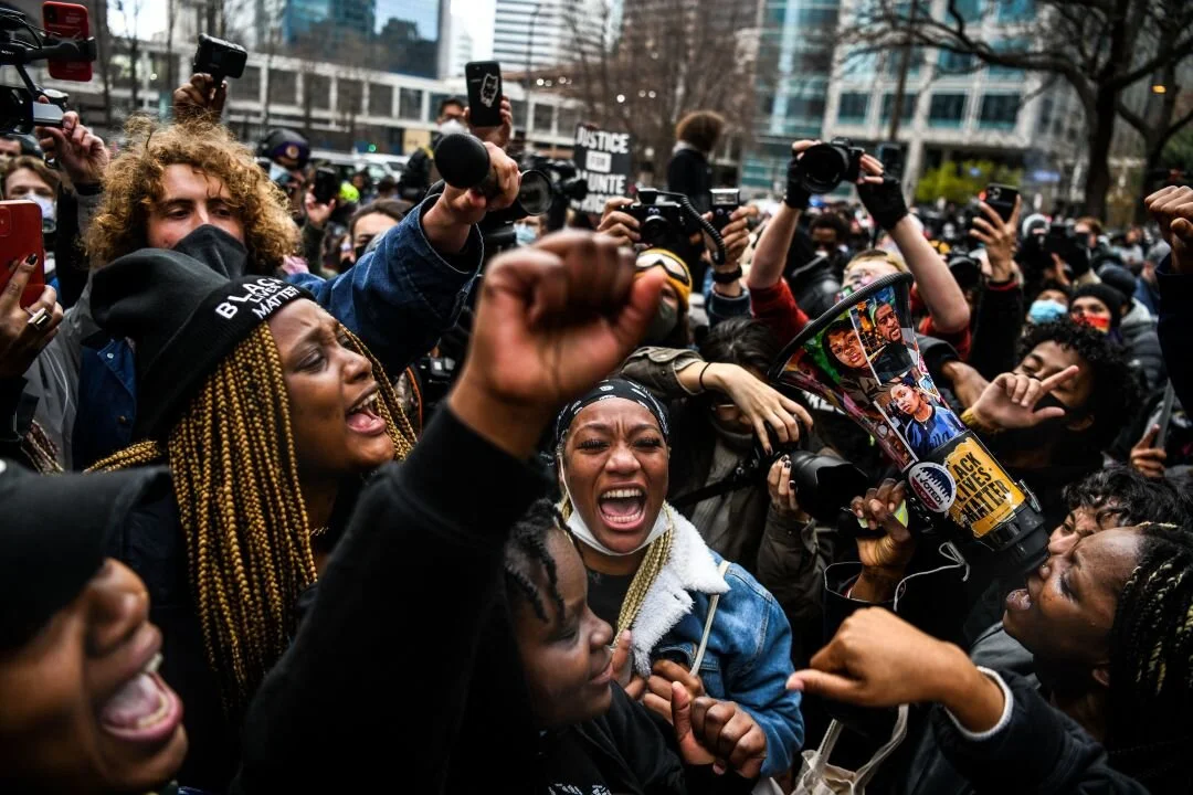 People celebrate as the verdict is announced in the trial of former police officer Derek Chauvin outside the Hennepin County Government Center in Minneapolis.Chandan Khanna / AFP VIA GETTY IMAGES