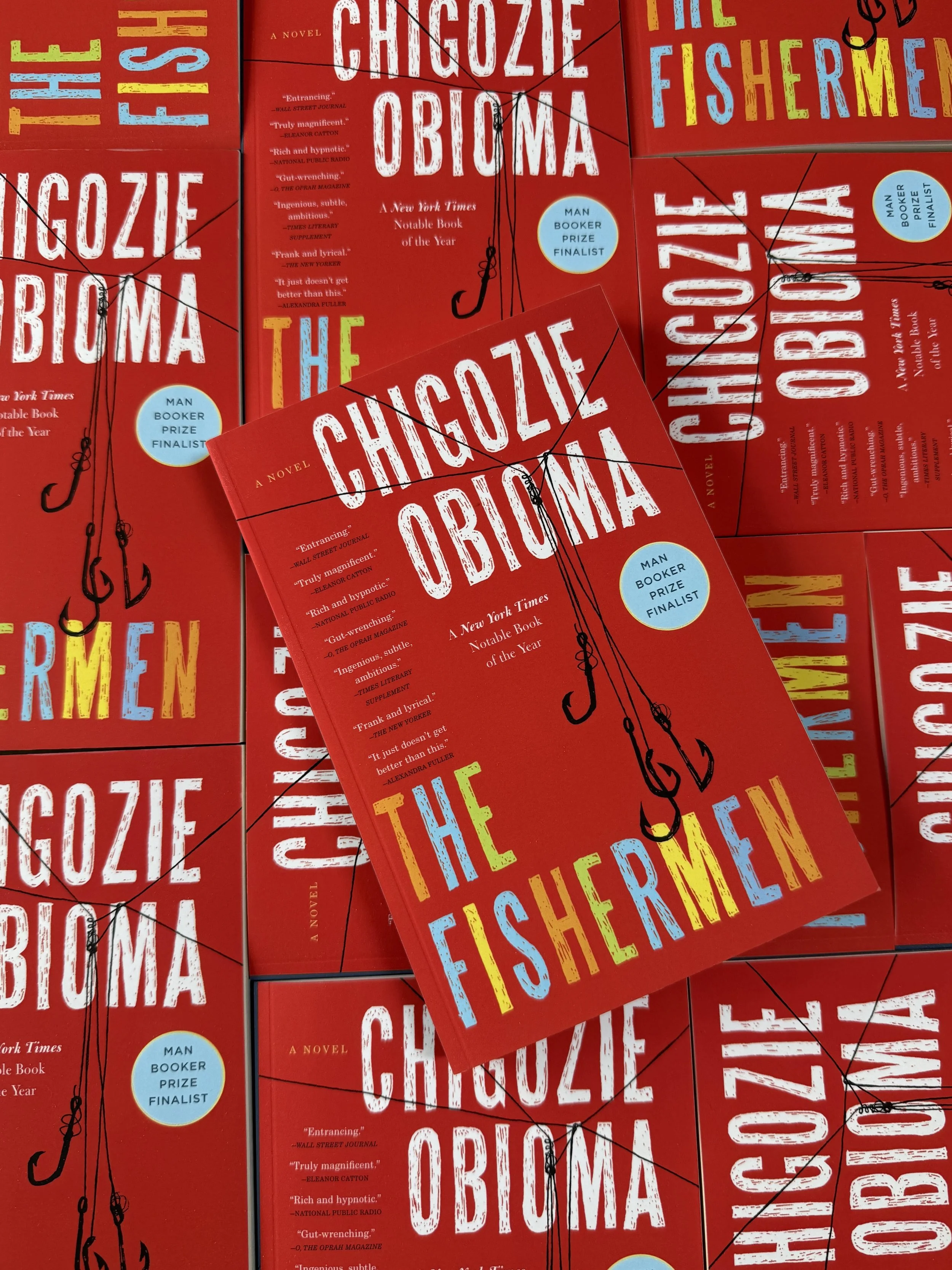 Red book cover with illustrated fishing hooks