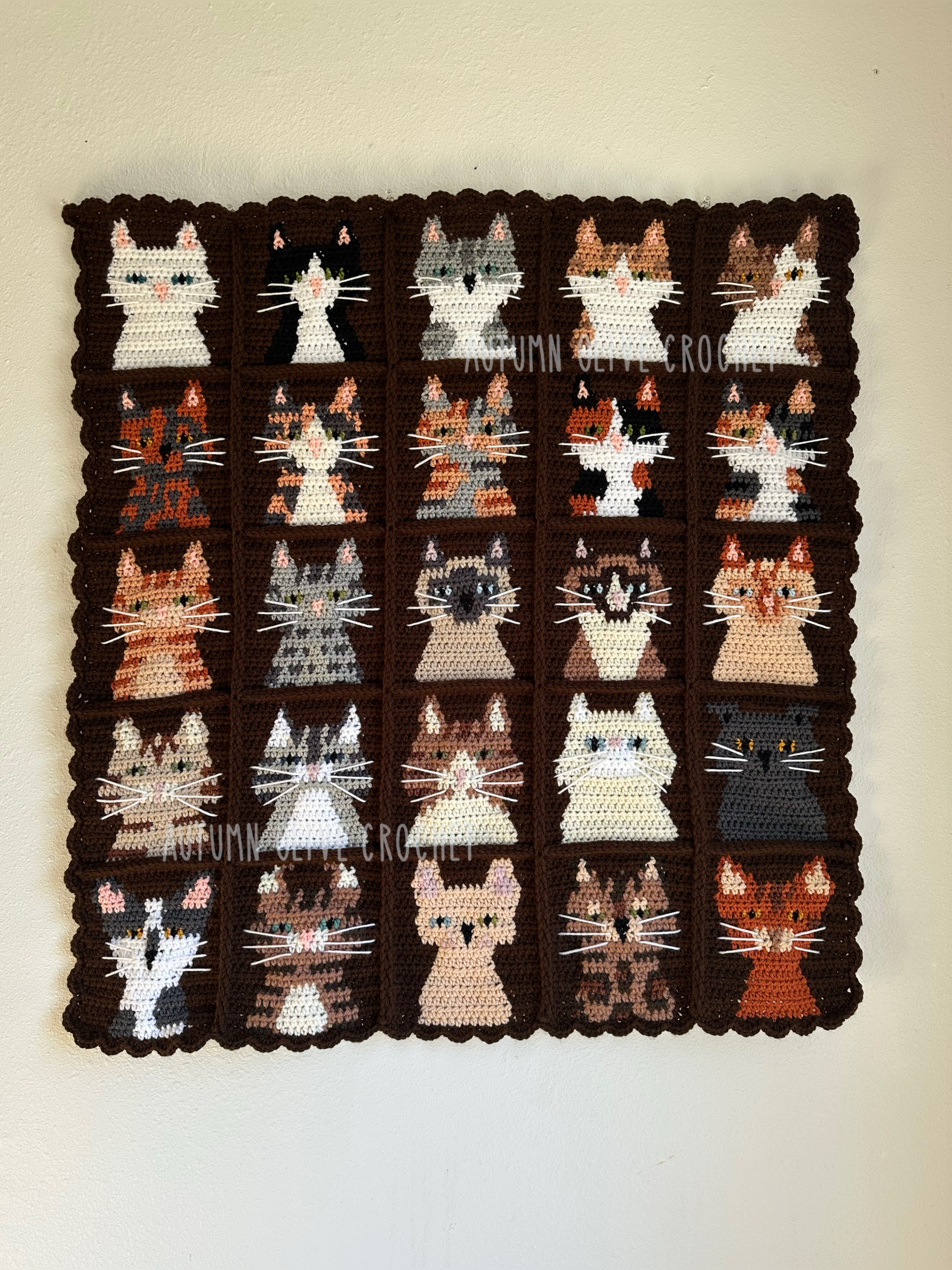 tapestry of all 25 cats! instructions included ♡