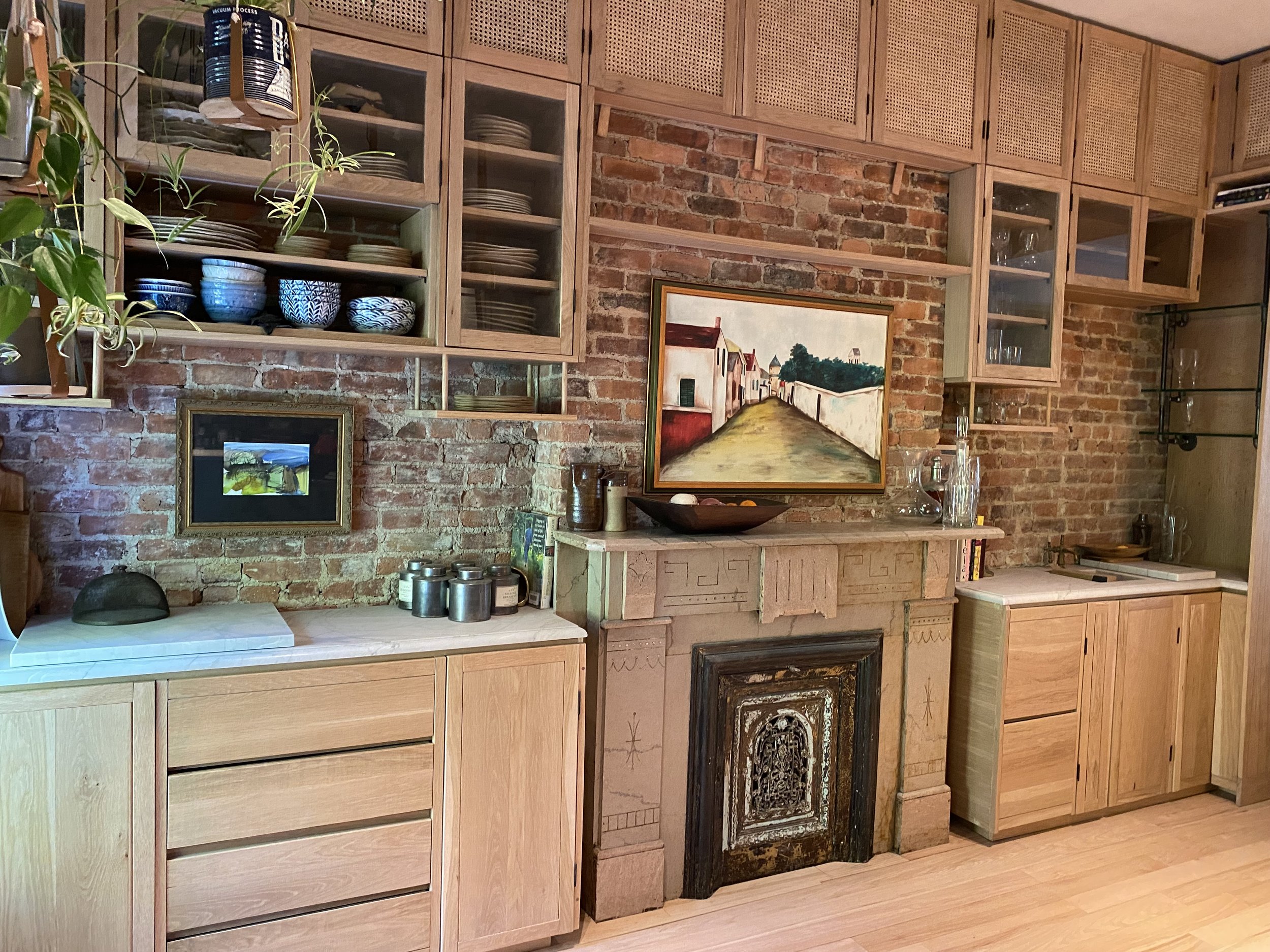 Parlor Bar Counter with Wraparound Storage and Pantry in solid White Oak and Caning