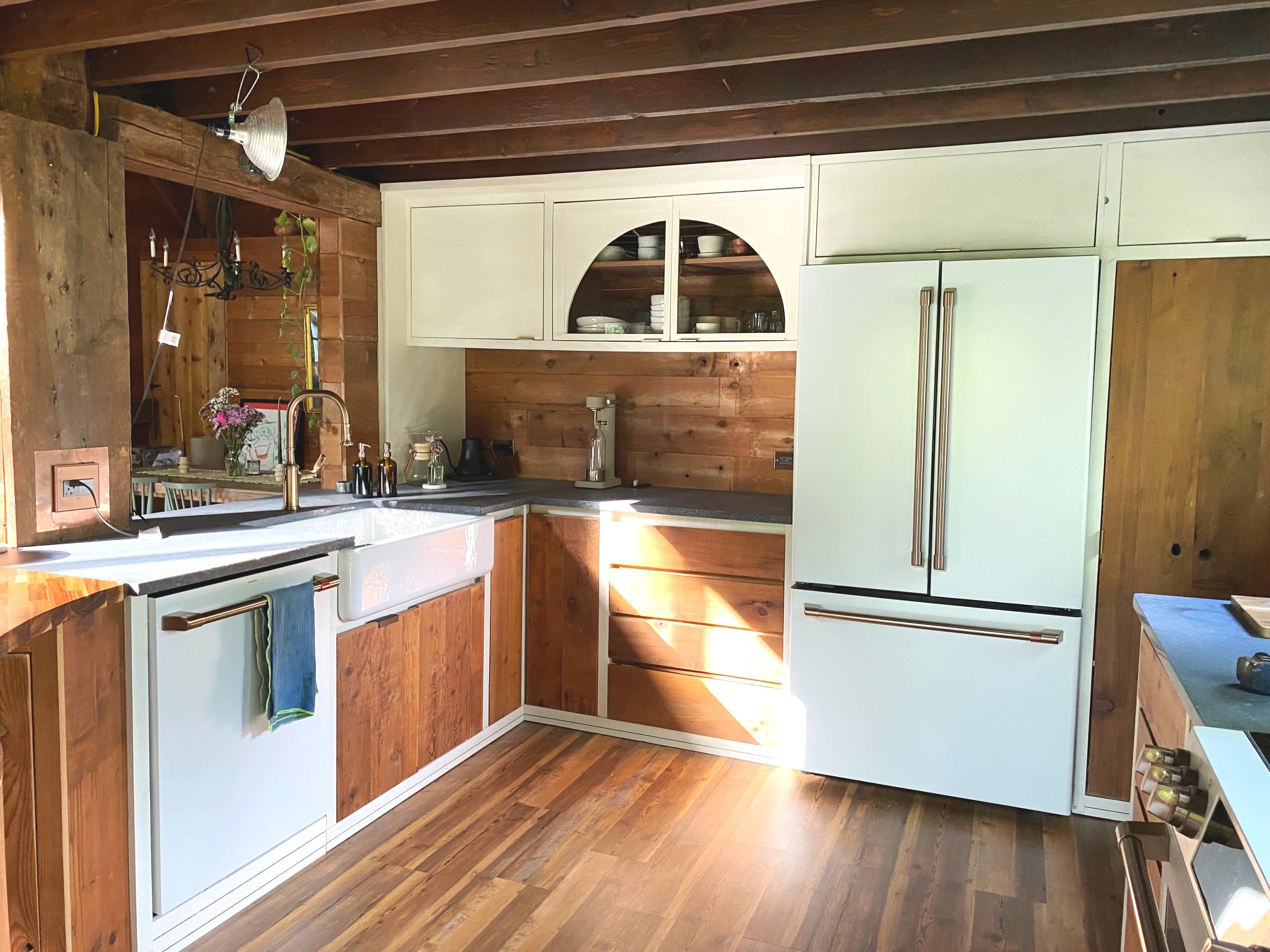 Full Design and Construction; Features a Curved Island, Pantry and Entry Cabinet;Repurposed cedar from the exposed ceiling for all Panel fronts; 2025