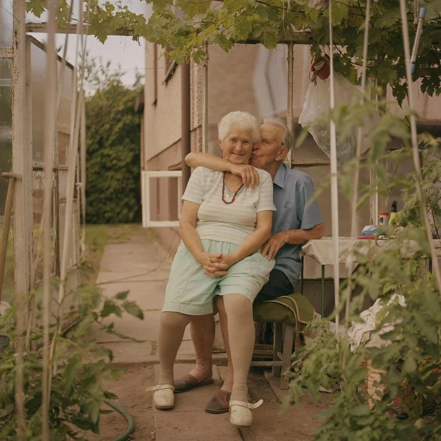 loving seniors sitting on a swing