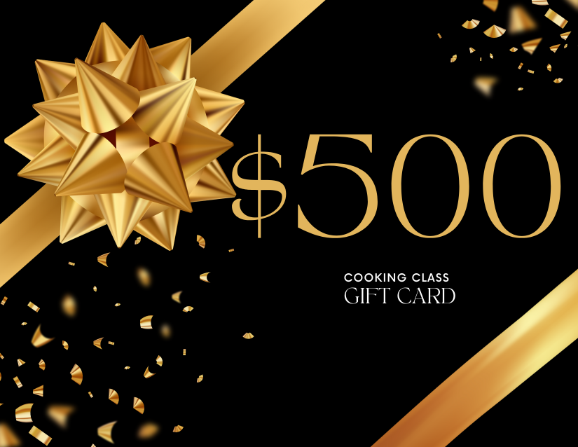A black gift card with gold accents, a large gold bow, and the text '$500 Cooking Class Gift Card' with scattered gold confetti.